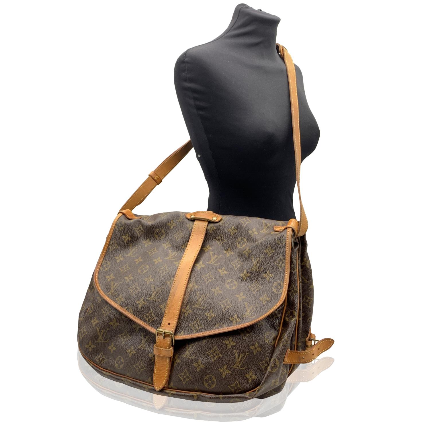 This beautiful Bag will come with a Certificate of Authenticity provided by Entrupy.  The certificate will be provided at no further cost.

LOUIS VUITTON 'Saumur 35' inspired by equestrian 'SADDLE' bag. The legendary SAUMUR features dual front