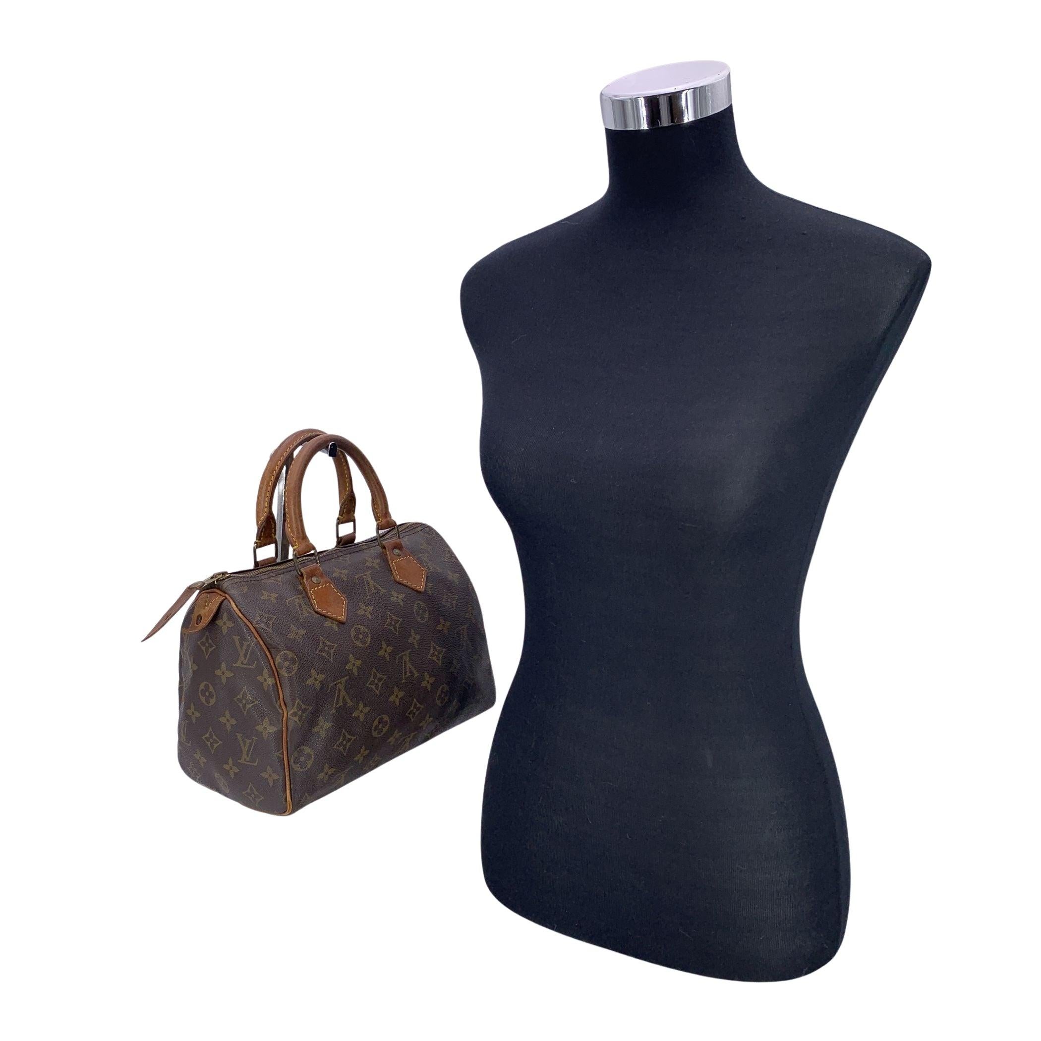 The Louis Vuitton Speedy 25 is an iconic piece from one of the most beloved lines in the Louis Vuitton collection. Known for its timeless appeal and versatility, this classic bag is crafted from the brand's signature brown monogram canvas, exuding
