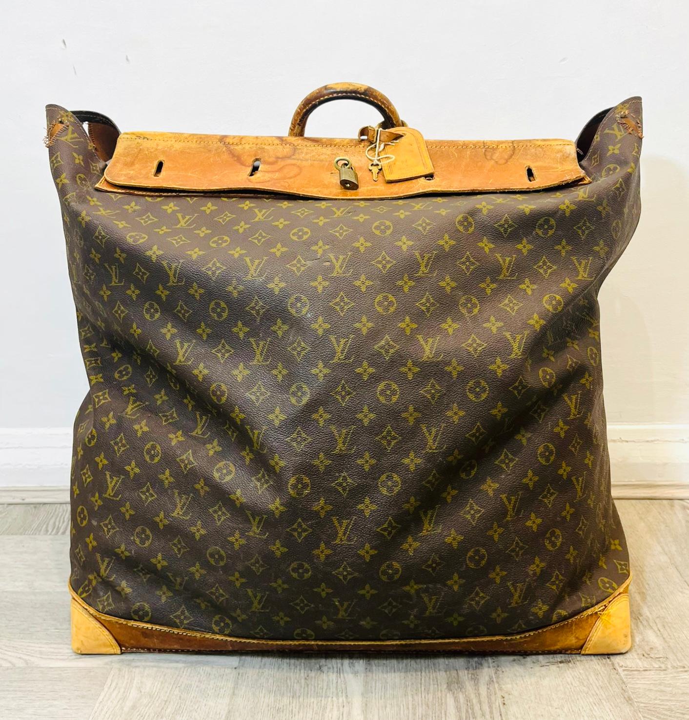 Louis Vuitton Vintage Monogram Canvas Steamer Travel Bag

Iconic brown monogram canvas bag detailed with tan leather base and top.

Designed in rectangular shape with padlock and key closure having 'Louis Vuitton' logo engraved.

Featuring leather