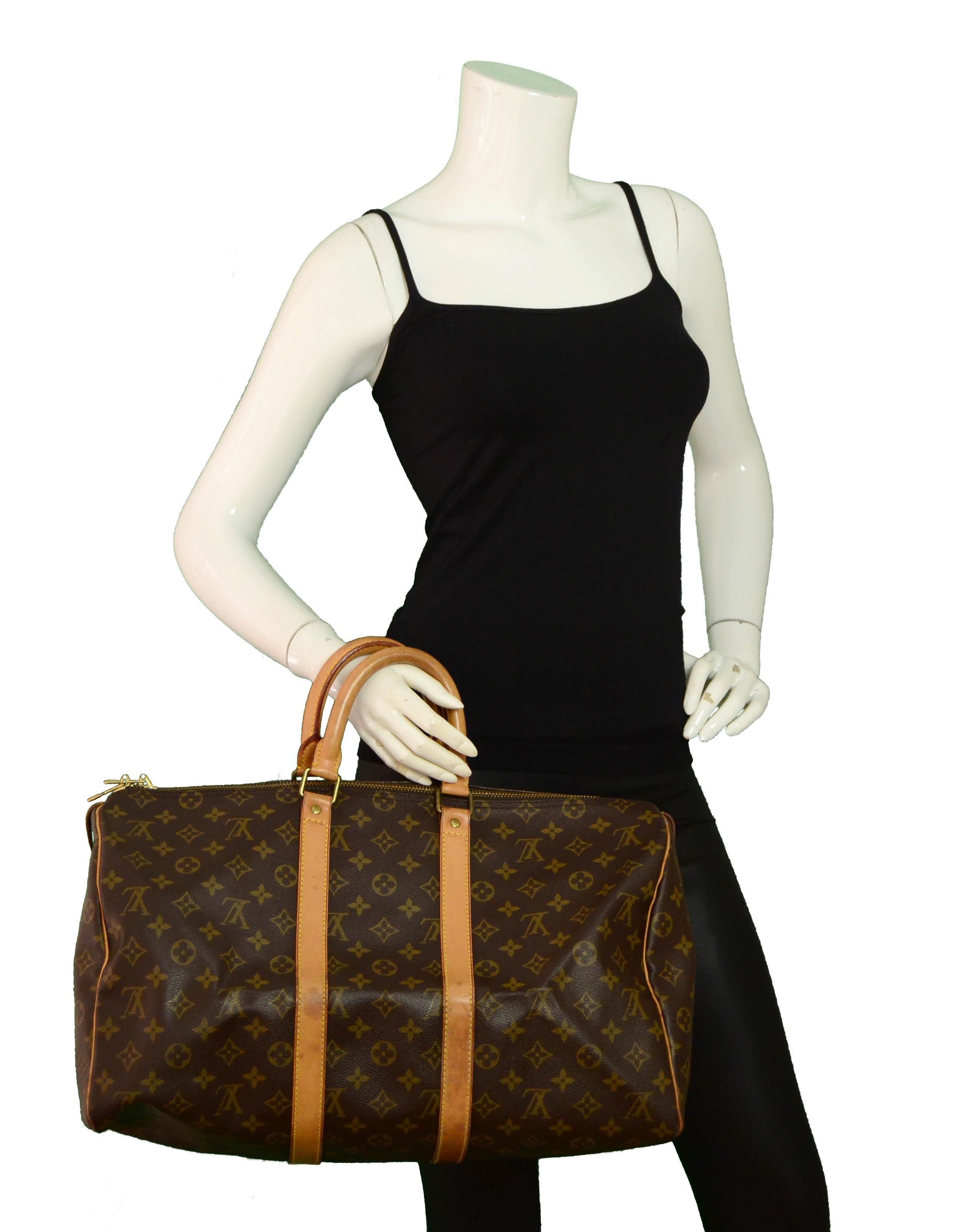 Louis Vuitton Monogram Keepall 45 Duffle Bag

Made In: France
Year of Production: 1990
Color: Brown Monogram
Hardware: Goldtone
Materials: Coated canvas & vachetta leather
Lining: Canvas
Closure/Opening: Zipper
Exterior Condition: Very good