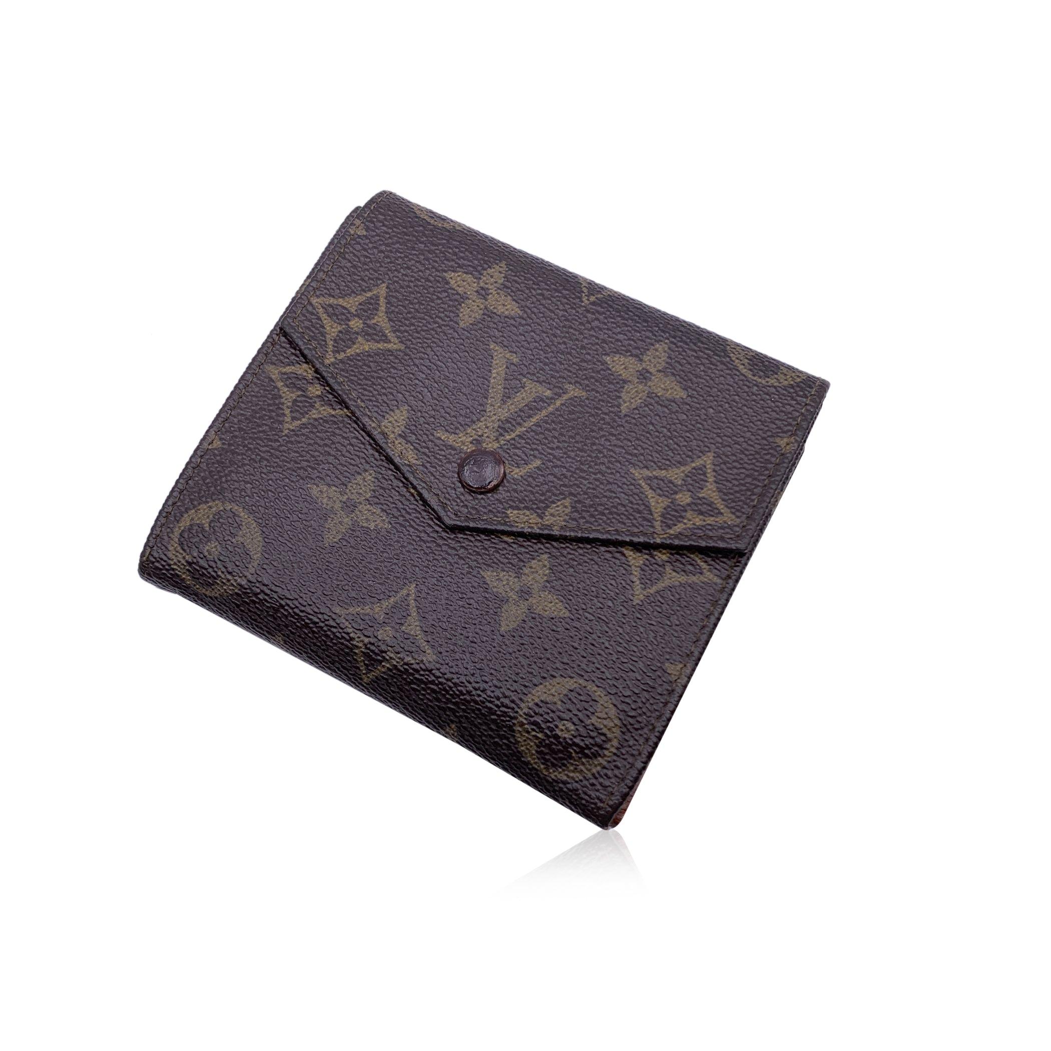 Louis Vuitton Vintage square-shaped wallet with double side flap. Crafted in brown monogram canvas. Leather lining. 1 flap coin compartment on a side and a trifold section on the other side, with 2 bill compartments, 4 credit card slots and 2 open