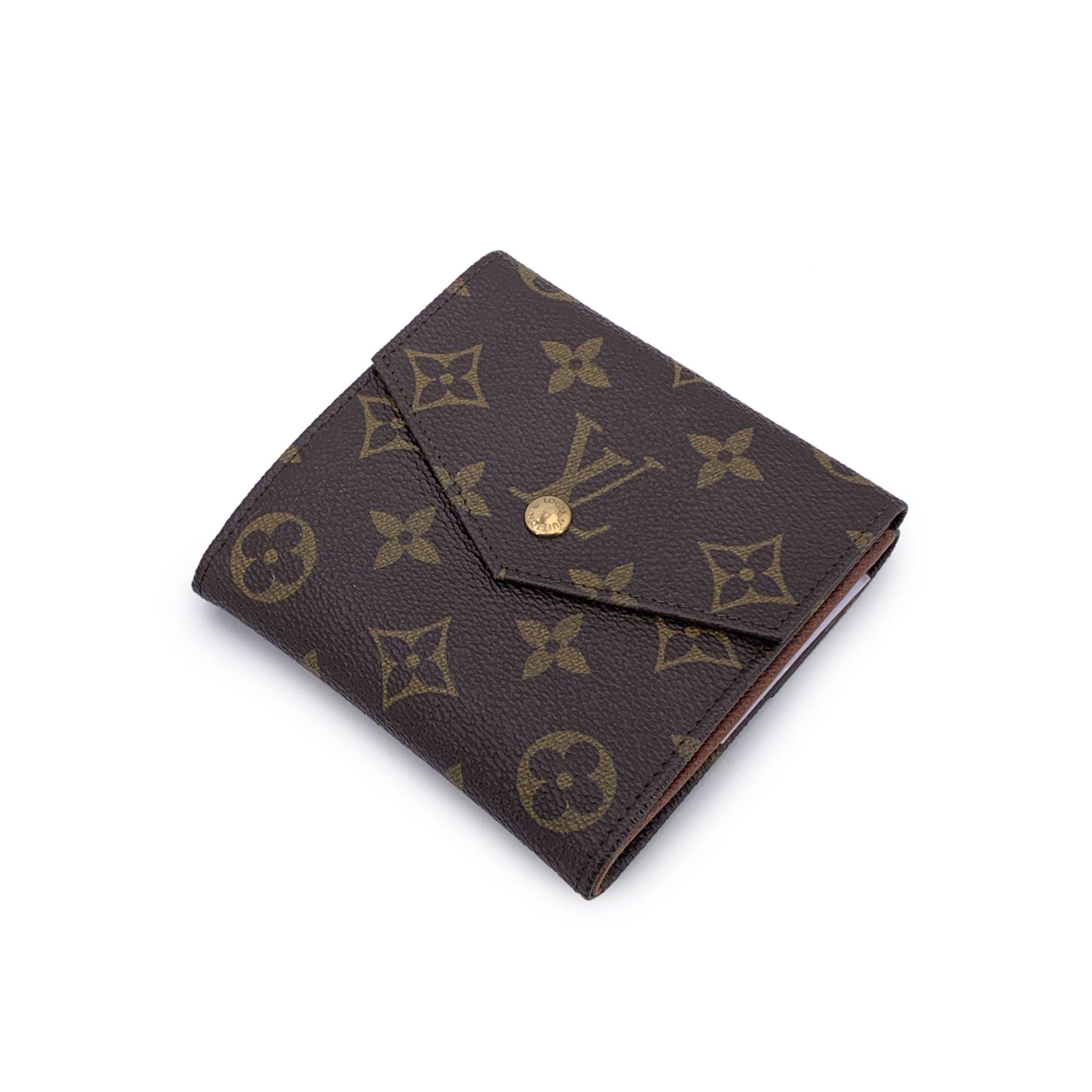 A timeless piece from the golden days of Louis Vuitton, this vintage square-shaped wallet is a study in classic craftsmanship and functional design. Made from the iconic brown Monogram canvas, it opens in a clever double side flap construction - a