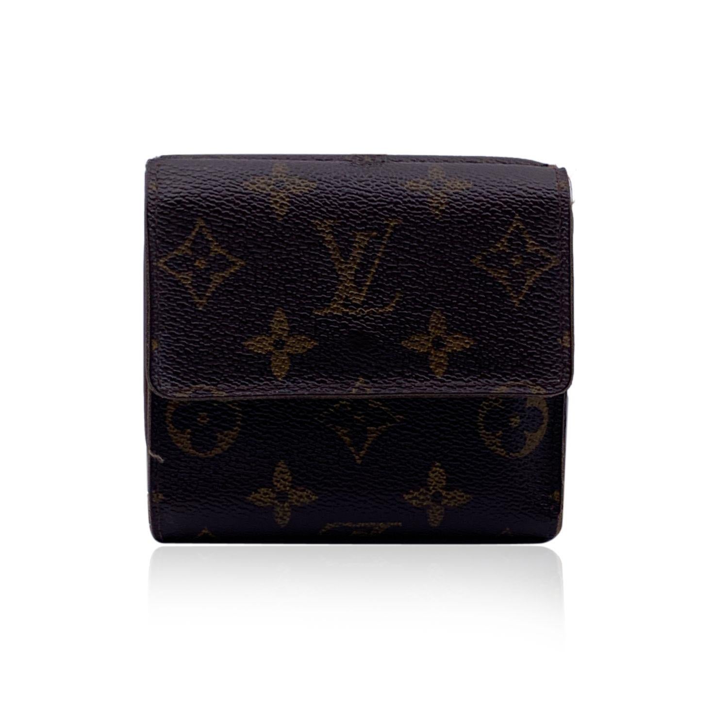 Louis Vuitton Vintage 'Elise' square-shaped wallet with double side flap. Crafted in brown monogram canvas. Tan leather lining. 1 coin compartment on a side and a bifold section on the other side, with 1 bill compartment, 6 credit card slots and 2