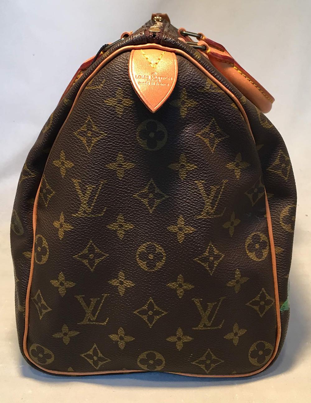 Louis Vuitton Vintage Monogram Hand Painted Yellow Sunflower Speedy 35 Handbag in excellent condition. Signature monogram canvas exterior trimmed with tan leather and brass hardware. Cluster of 5 hand painted yellow sunflowers along front side with