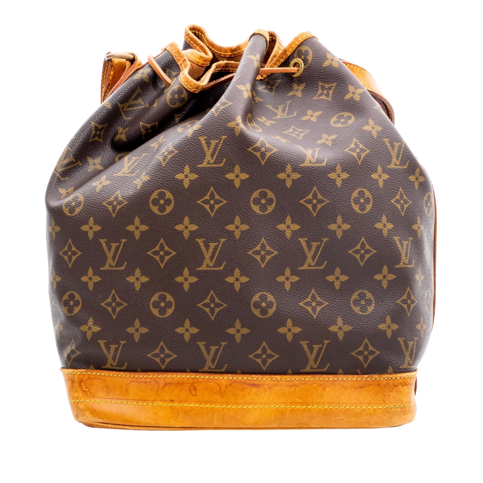 This bag is made with brown monogram coated canvas with vachetta leather trim, base and straps. The bag features an open top with drawstring closure that opens to brown woven fabric lining. Vintage item.

Authenticated by entrupy.

Color: Brown with