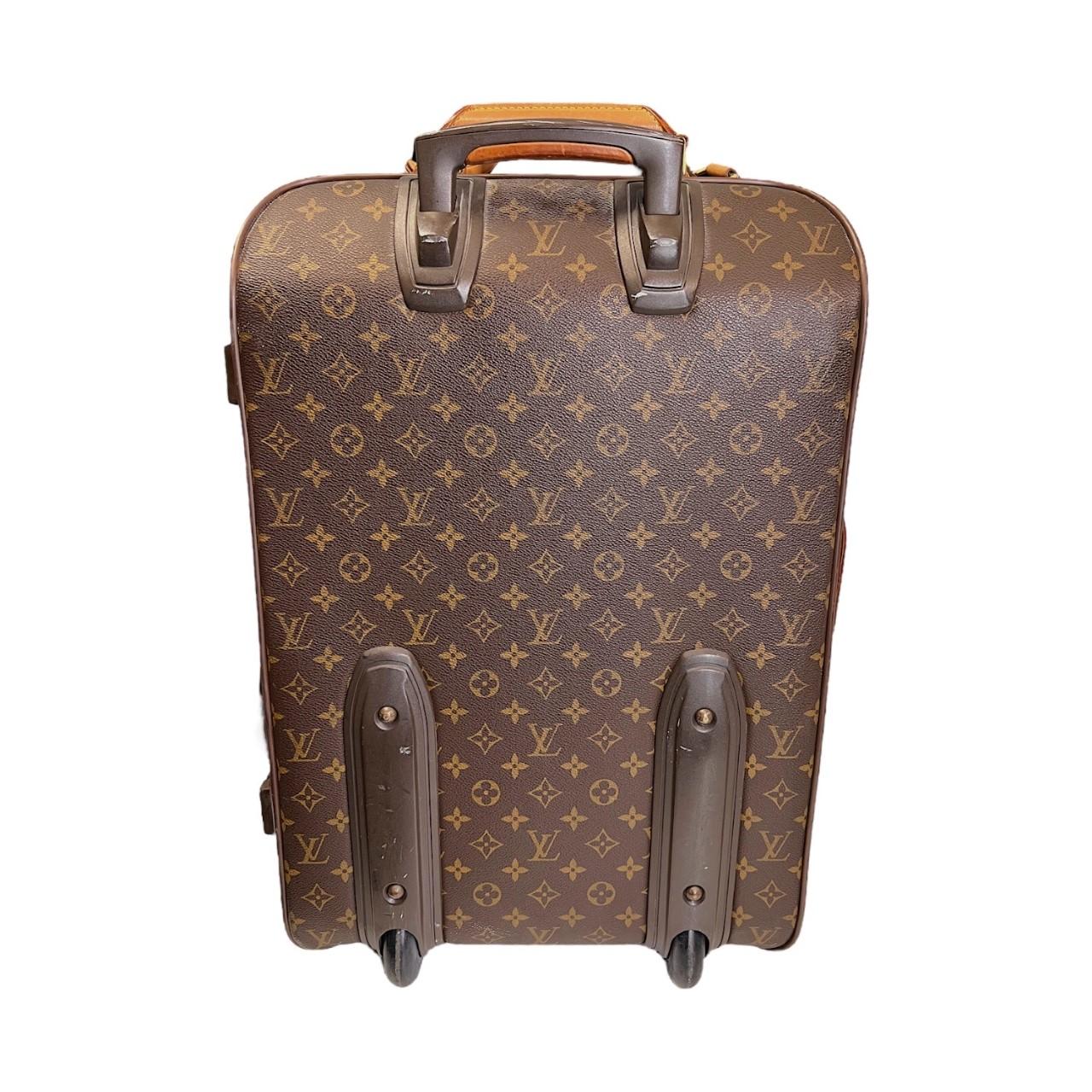 We are offering this Louis Vuitton Pegase 45 rolling suitcase. Made in France, it is crafted the classic brown Louis Vuitton monogram coated canvas with leather trimming with a leather corner accent and gold-tone brass hardware. It features a