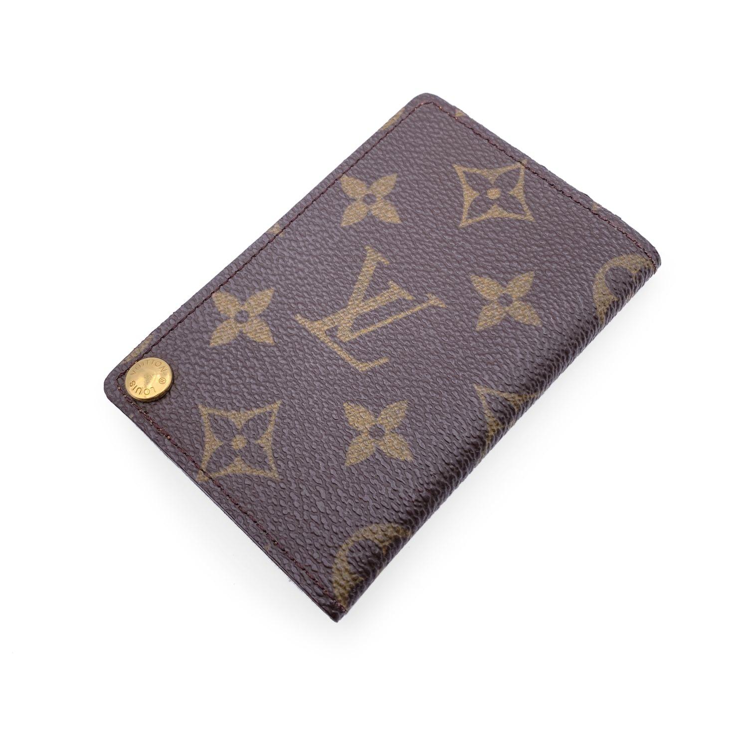 Vintage Louis Vuitton Porte Carte Pression Card Holder. Crafted in brown monogram canvas. Tan leather lining. 7 plastic slots for cards. 'Louis Vuitton Paris - Made in France' embossed inside. Authenticity serial number embossed inside Details