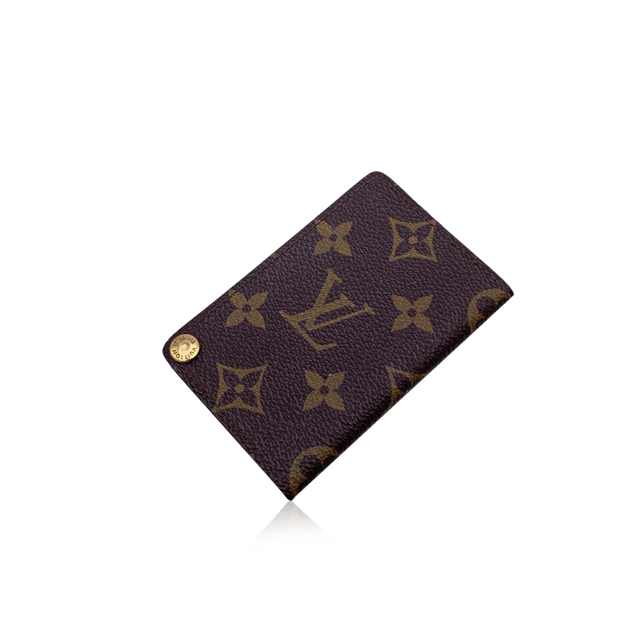 Vintage Louis Vuitton Porte Carte Pression Card Holder. Crafted in brown monogram canvas. Tan leather lining. 6 plastic slots for cards. 'Louis Vuitton Paris - Made in France' embossed inside. Authenticity serial number embossed inside Condition B -
