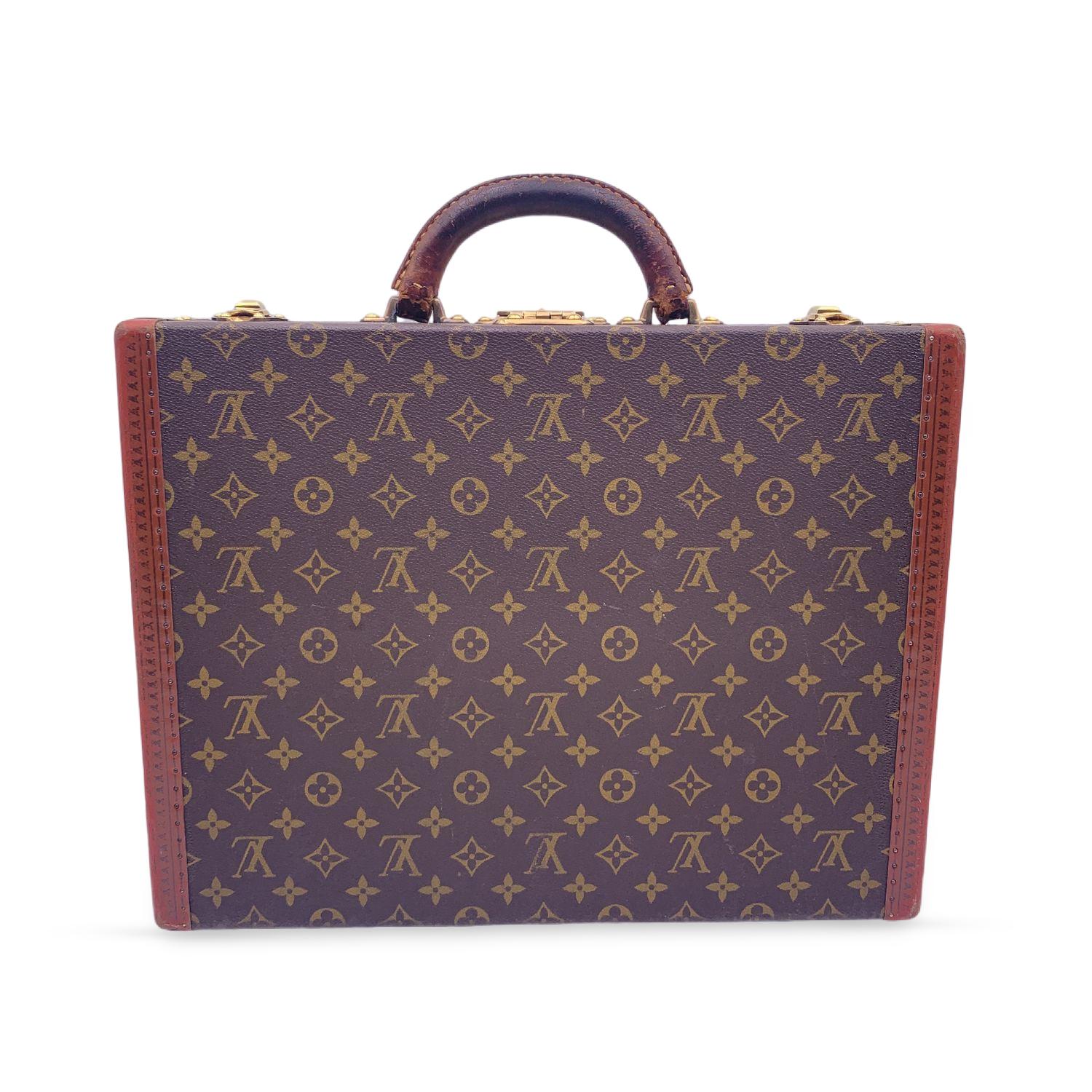 Gorgeous vintage Louis Vuitton 'President' hard-side briefcase in timeless monogram canvas with genuine leather handle. Monogram canvas. LV monograms embossed on trim. Rounded leather handle. Canvas interior with 1 side leather strap with buckle.