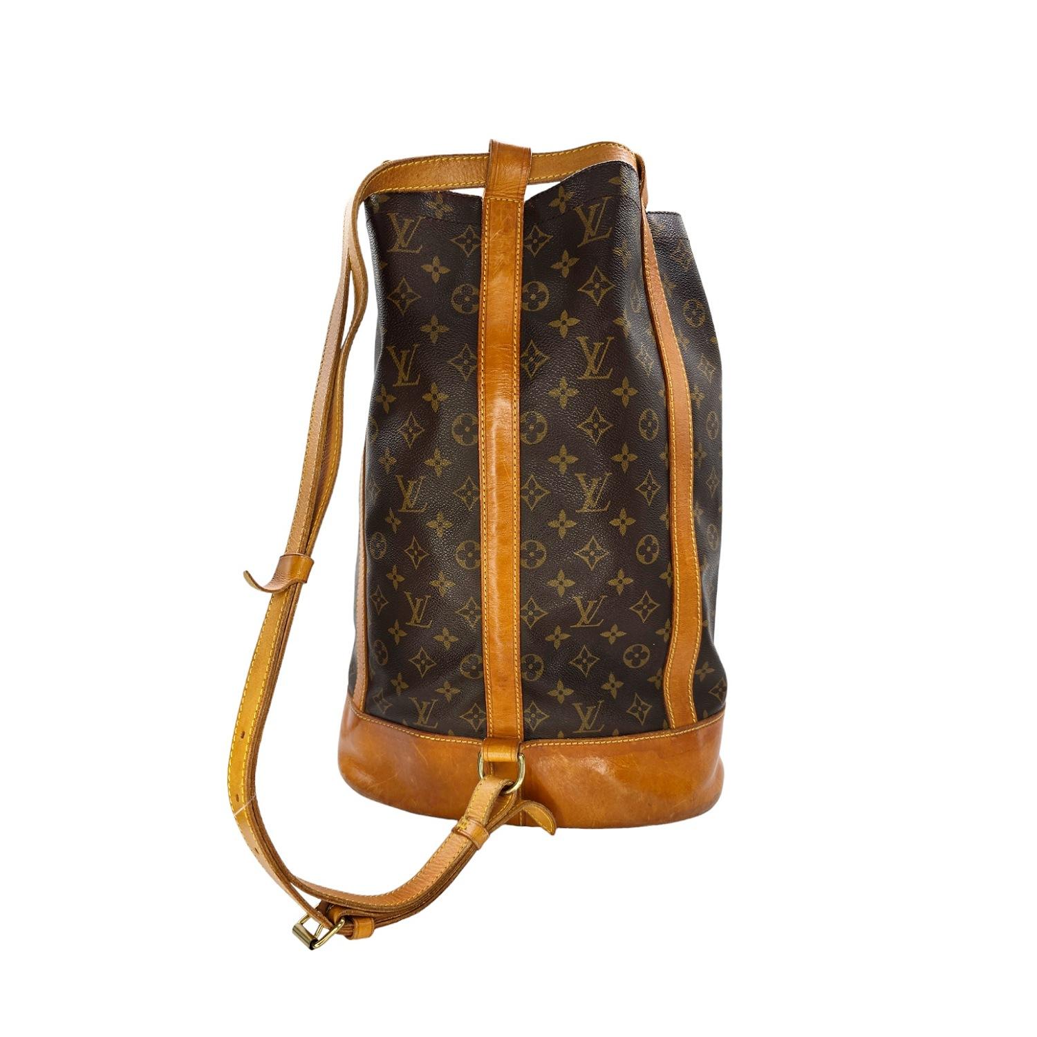 This Louis Vuitton Vintage Monogram Randonnee GM is a true statement piece. Made with exquisite detailing and Monogram canvas, its pure shape makes it an ideal city bag. Featuring a detachable interior pocket, this bucket bag is not only stylish but