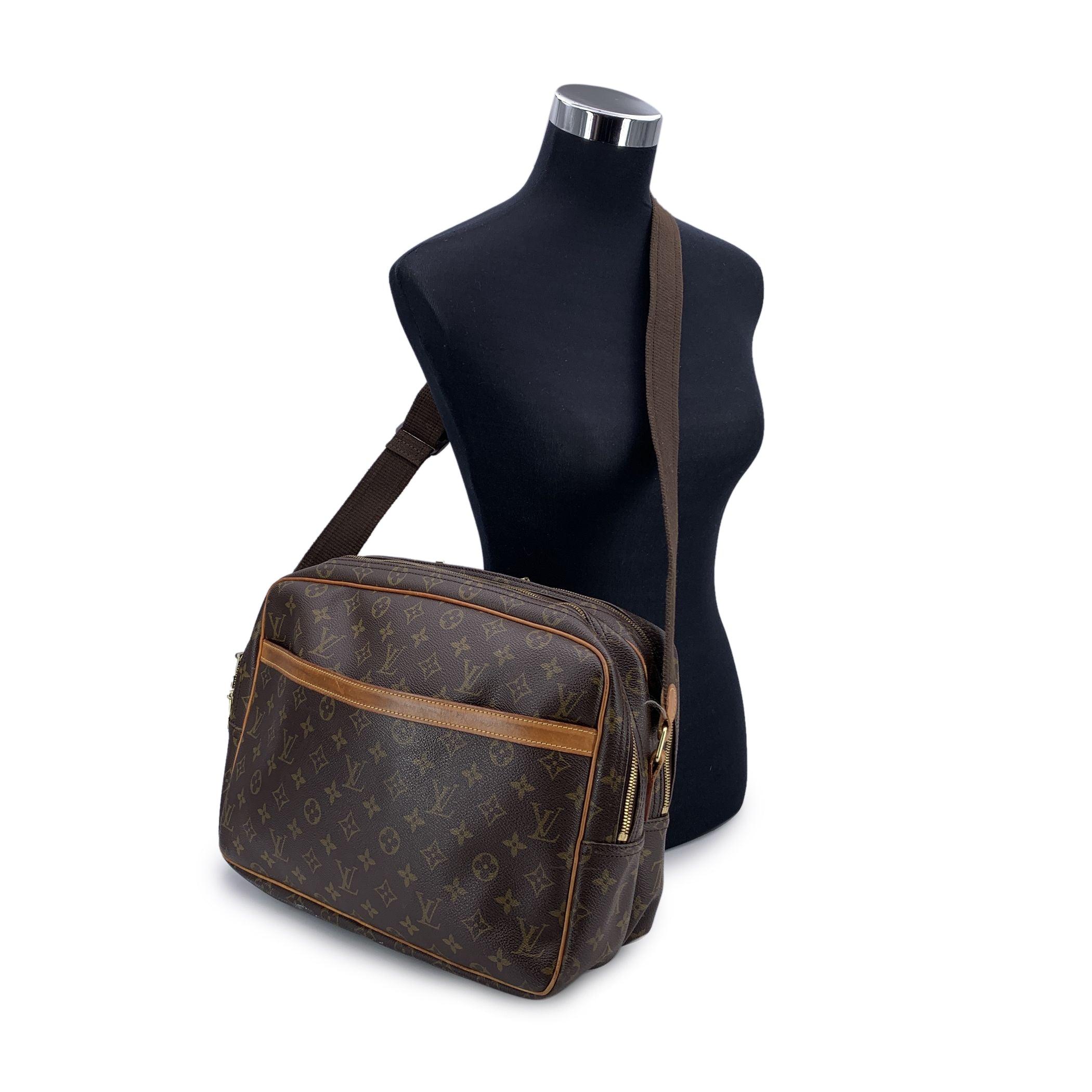 This vintage Louis Vuitton 'Reporter GM' is a timeless classic, expertly crafted from signature monogram canvas with luxurious vacchetta leather trim. With its sleek and functional design, this unisex messenger bag features 1 large open pocket on