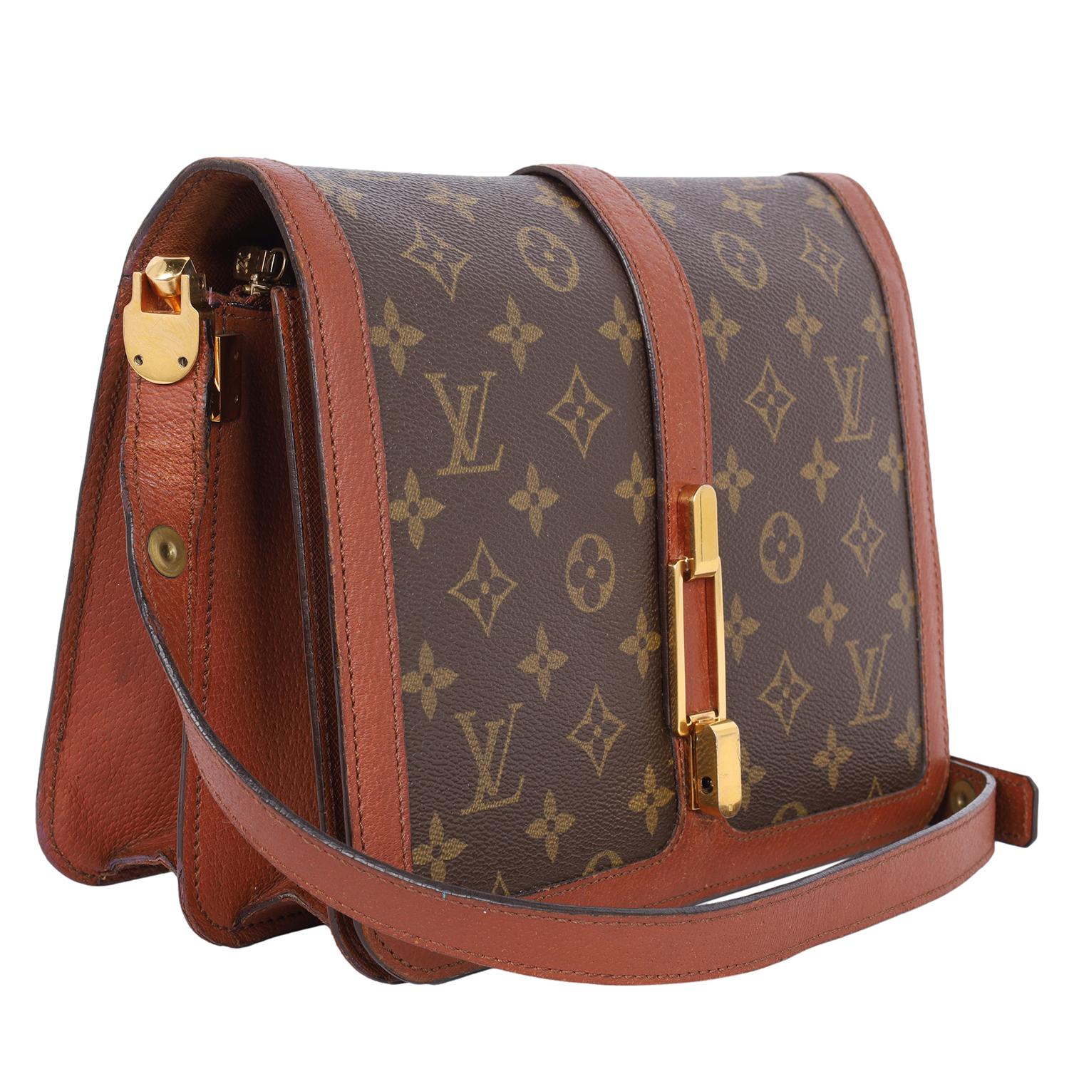 Authentic, pre-loved Louis Vuitton vintage monogram Rond Point shoulder bag. Features monogram canvas with leather accents, front flap closure with gold locking clasp, adjustable shoulder strap, large interior with large open pockets, zipper middle