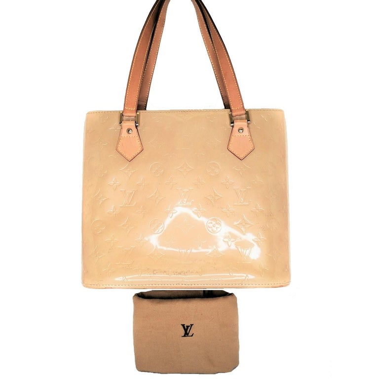 Vernis monogram patent leather Louis Vuitton Houston tote with brass hardware, tan Vachetta leather trim, dual flat shoulder straps, beige leather lining, dual pockets at interior walls; one with zip closure and zip closure at top. Retail price is