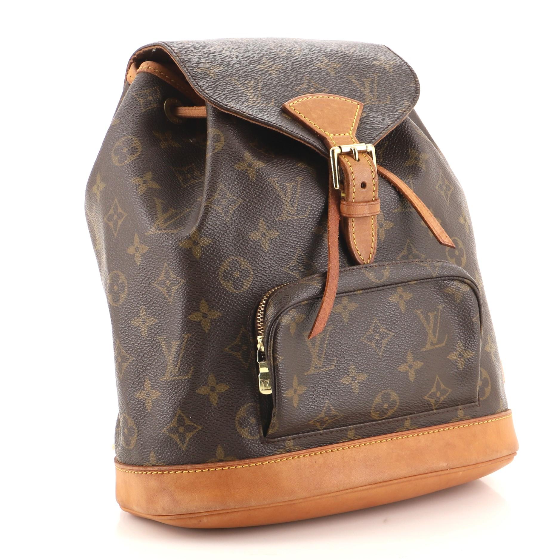 Condition: Fair. Odor in interior. Creasing on exterior, heavy darkening, wear and watermarks on leather trims and straps. Peeling and splitting on flap closure and straps wax edges, discoloration underneath flap and in interior, scratches and heavy