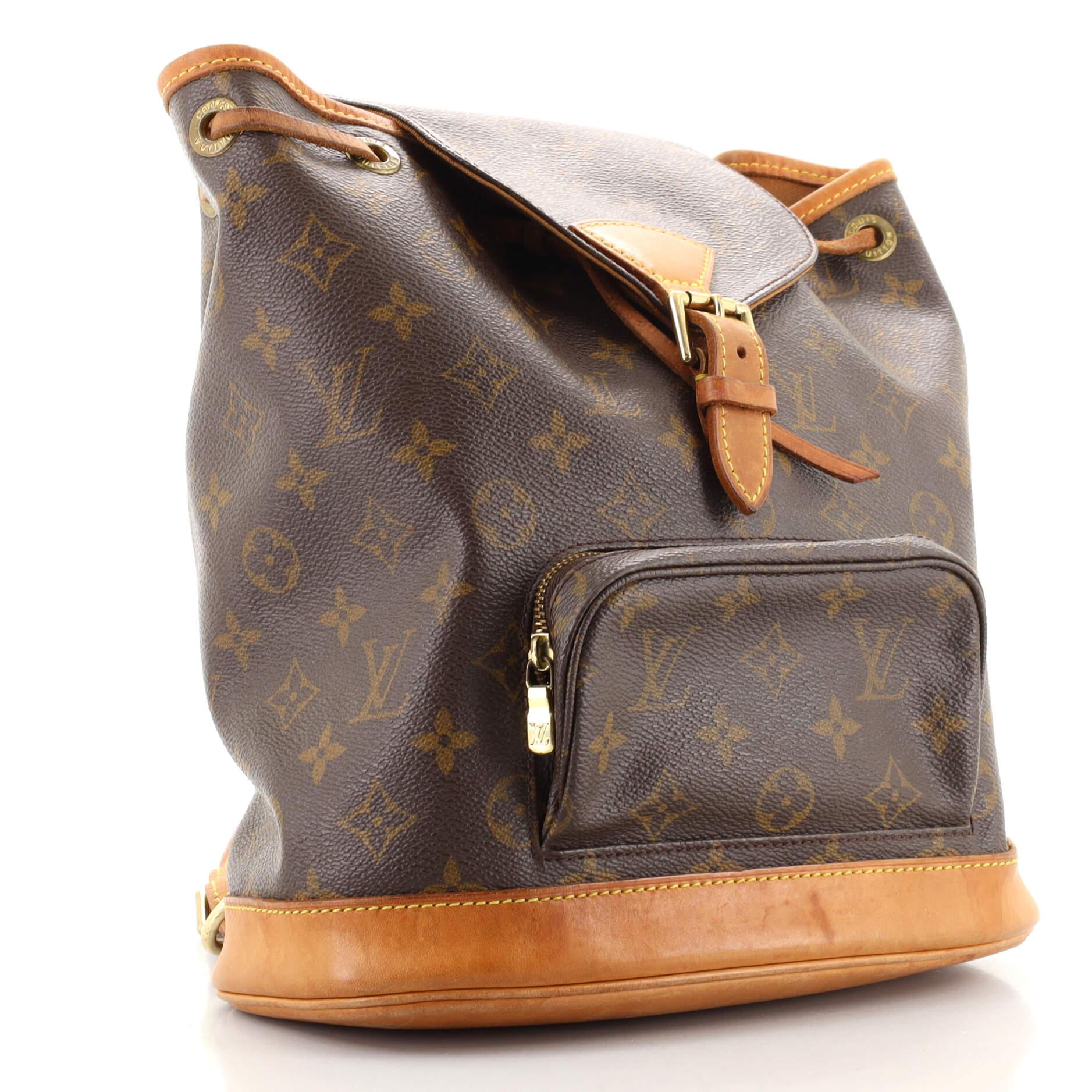 Condition: Fair. Odor in interior. Heavy darkening, scuffs, wear and water stains on base, leather trims and straps, splitting on strap wax edges. Creasing on exterior, discoloration and wear in interior, scratches and tarnish on