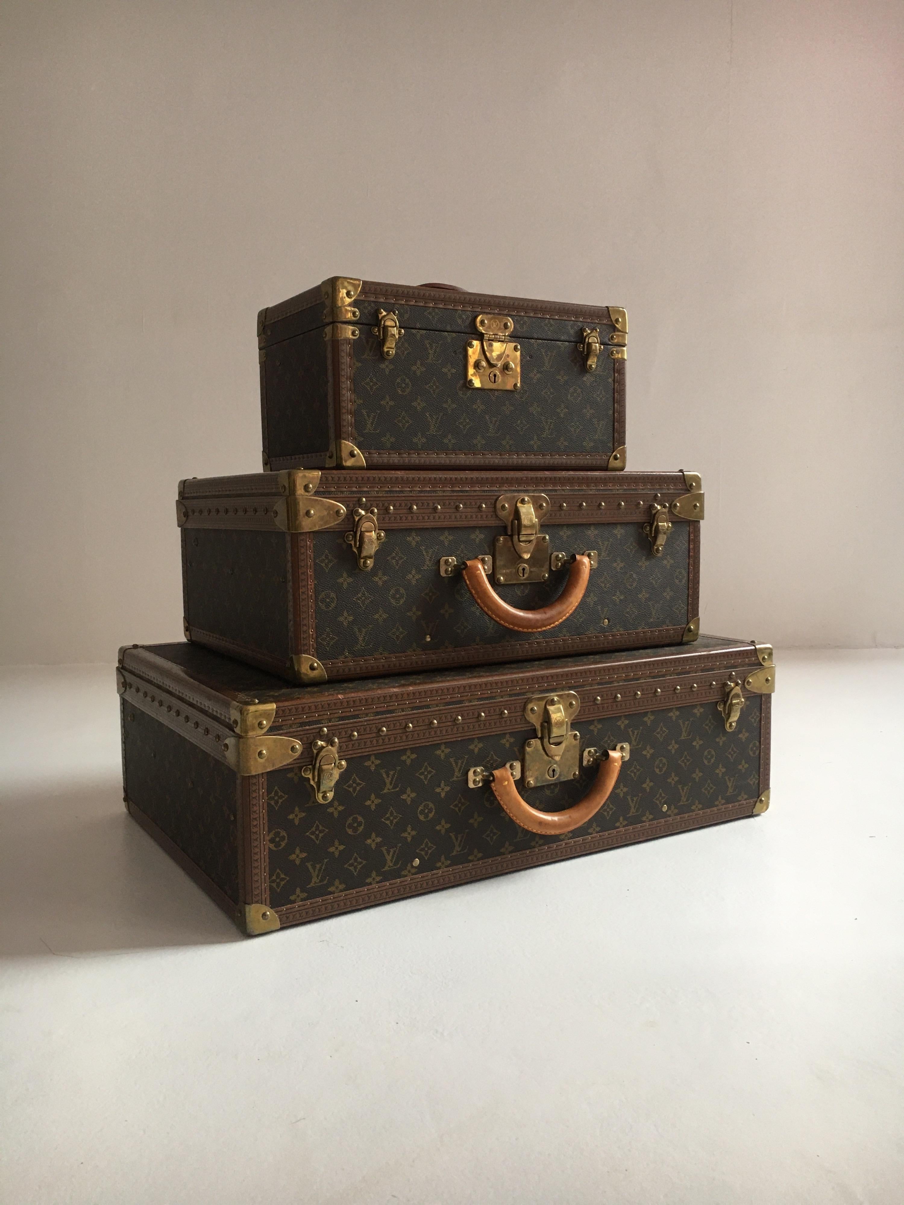 Louis Vuitton vintage petite Eifel Tower Stack Alzer Trunks set of three, France, 1970s. Alzer 70, Alzer 55 and the famous train case, in one beautiful set in gently used vintage condition.