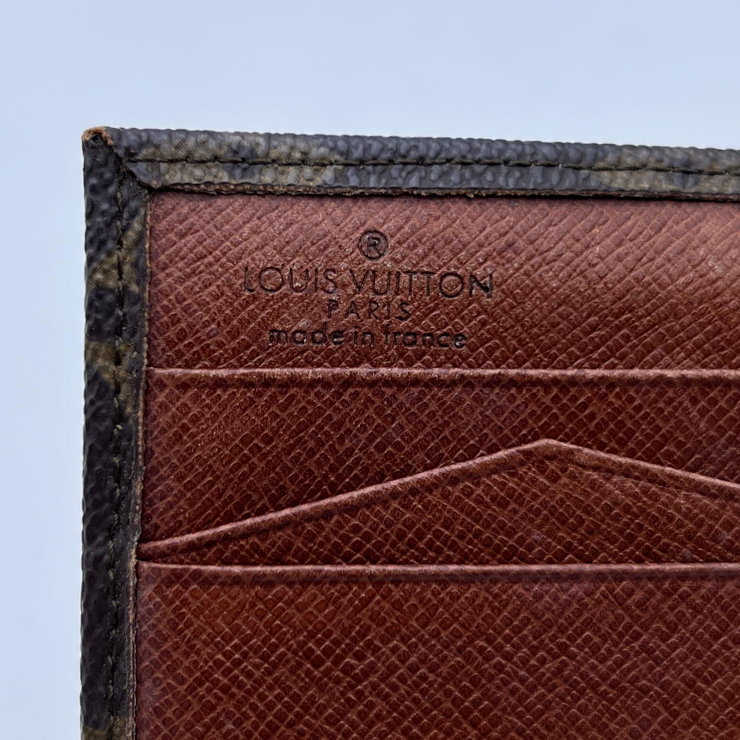 Louis Vuitton Vintage square-shaped wallet with double side flap. Crafted in brown monogram canvas. Tan leather lining. 1 flap coin compartment on a side and a trifold section on the other side, with 2 bill compartments. 'Louis Vuitton Paris - Made