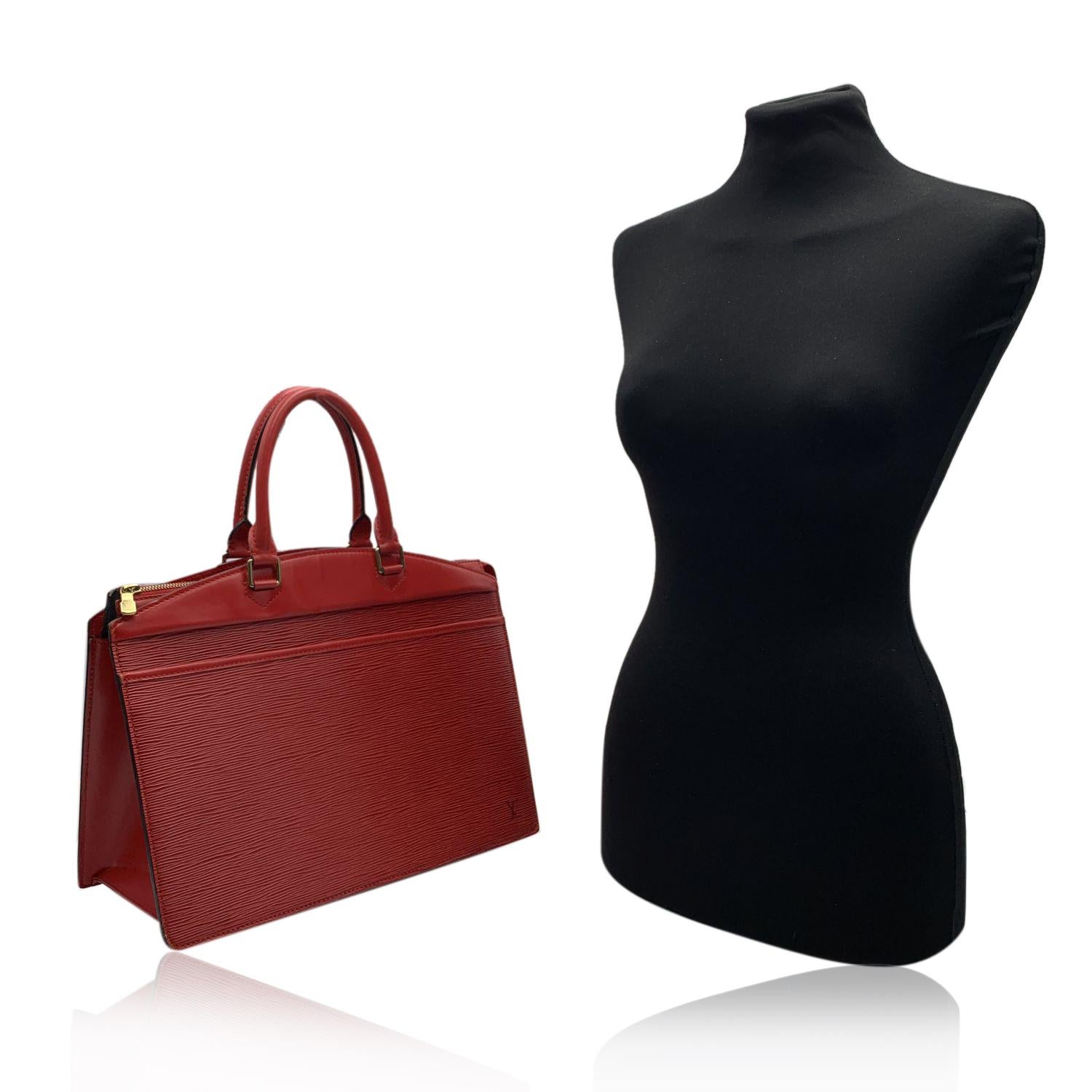 This bag will come with a Certificate of Authenticity provided by Entrupy, at no further cost.

Louis Vuitton Vintage Red Epi Leather Riviera Bag . Red Epi Leather with smooth leather trim, rolled handles, 1 exterior slip pocket, a upper zip