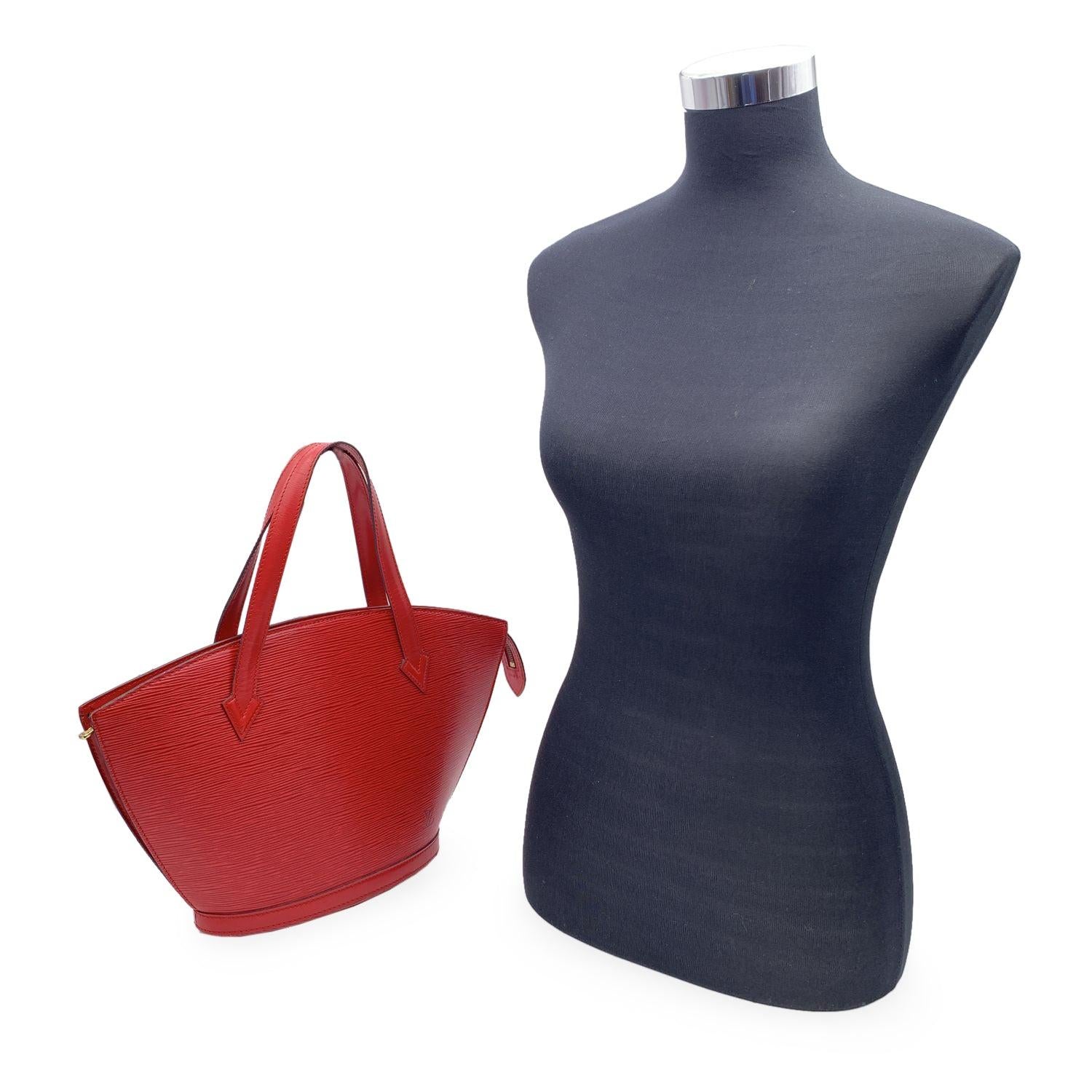 Sophisticated 'Saint Jacques PM' Shoulder Bag by LOUIS VUITTON, crafted in red EPI leather. The bag features a main compartment with upper zipper closure. Grey microfiber internal lining with 1 side pocket inside. 'LOUIS VUITTON Paris - Made in