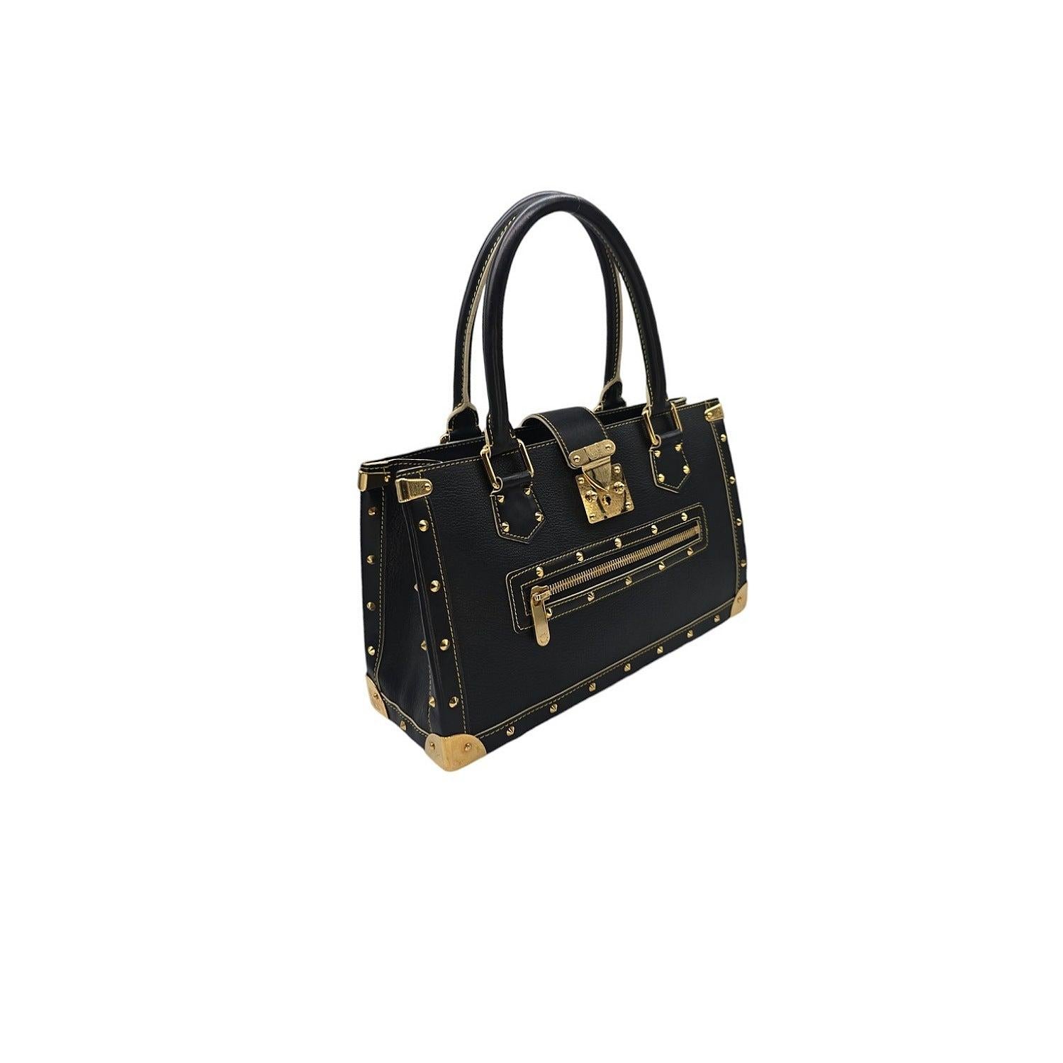 Expertly crafted with select leather, this Louis Vuitton Vintage Suhali Le Fabuleux Tote exudes elegance and class. Its polished hardware, including corner plates and decorative studs, adds a touch of luxury. The spacious interior, with a zip and