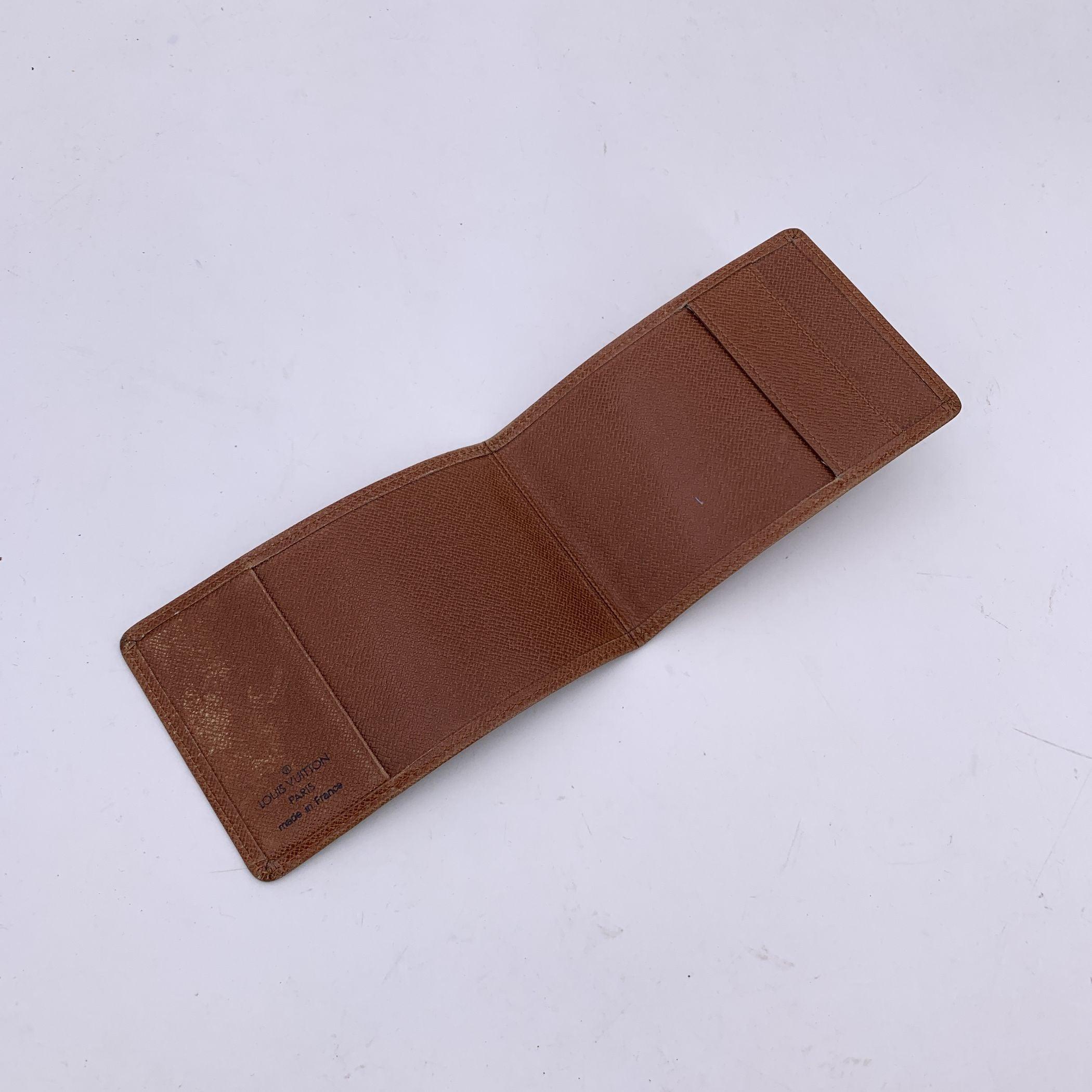 Elevate your everyday essentials with this vintage Louis Vuitton Tan Taiga Leather Porte Chequier Checkbook Holder. Crafted from the brand's signature Taiga leather in a rich tan hue, this piece exudes sophistication and durability. The smooth yet