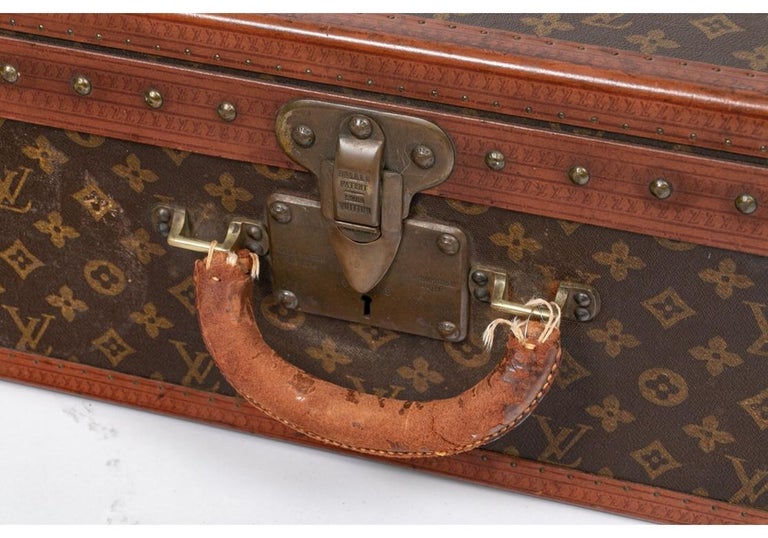 Sold at Auction: Louis Vuitton, A vintage travellers suitcase, leather and faux  leather. (D:53 x W:76 x H:18 cm)