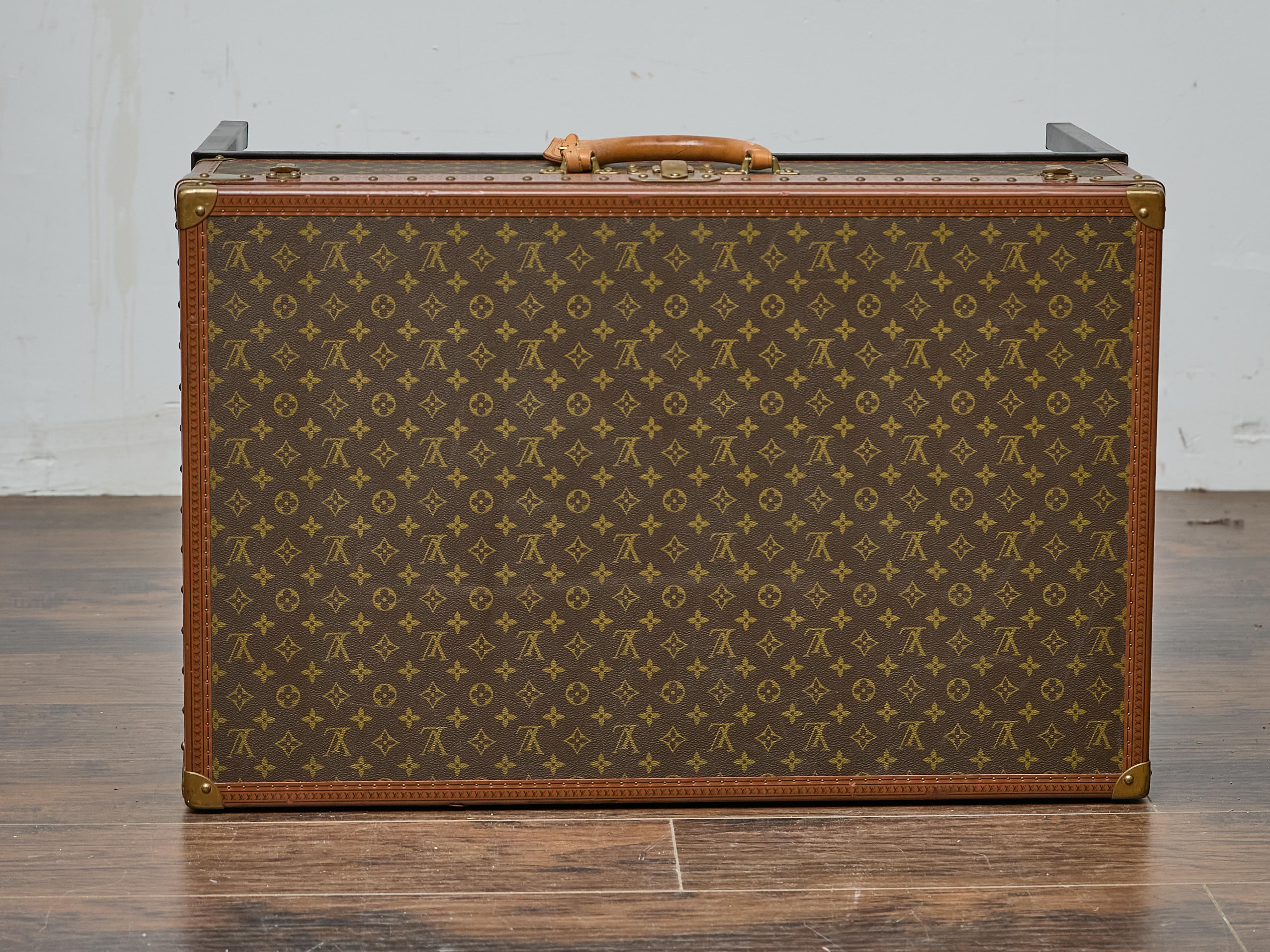 Metal Louis Vuitton Vintage Trunk Made into Coffee Table on Custom Base For Sale