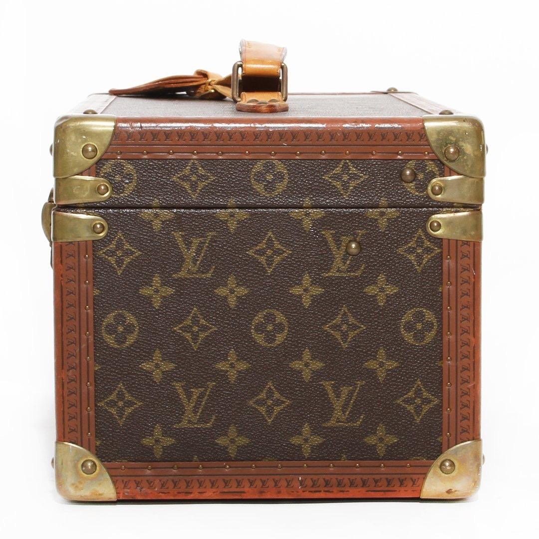 Vanity case by Louis Vuitton
Vintage 
Monogram leather
Natural cowhide leather top handle and trim
Flip-lock closure 
Leather interior
One removable interior shelf
Gold-tone hardware
Built-in mirror 
Suede interior 
Made in France 
Condition: Great