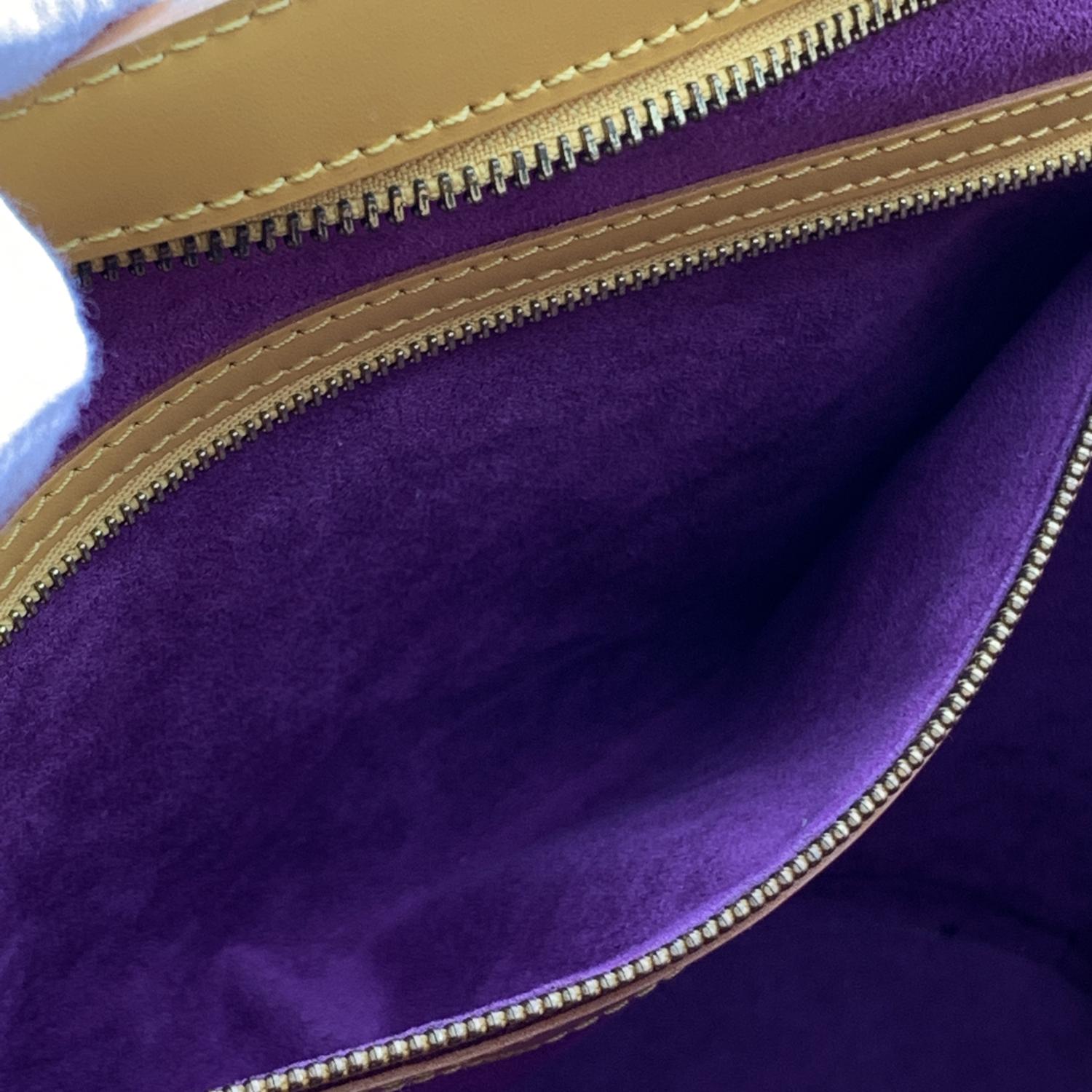 Sophisticated 'Saint Jacques GM' Shoulder Bag by LOUIS VUITTON, crafted in yellow EPI leather. The bag features a large main compartment with upper zipper closure. Purple microfiber internal lining with 1 side zip pocket inside. 'LOUIS VUITTON Paris