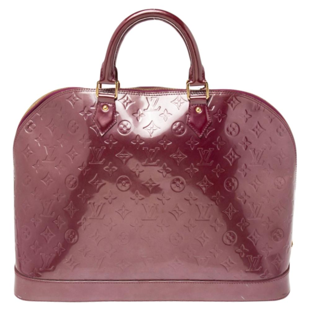 Out of all the irresistible handbags from Louis Vuitton, the Alma is the most structured one. First introduced in 1934 by Gaston-Louis Vuitton, the Alma is a classic that has received love from icons. This piece comes crafted from Monogram Vernis