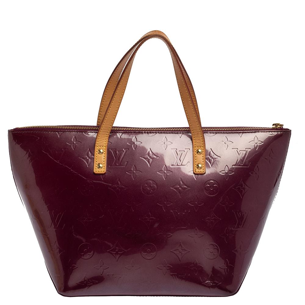 Your quest ends here with this Bellevue from Louis Vuitton. Wonderfully crafted from Monogram Vernis leather, the bag brings a lovely purple shade, two contrast handles, and a spacious fabric interior where you can carry all your essentials. The