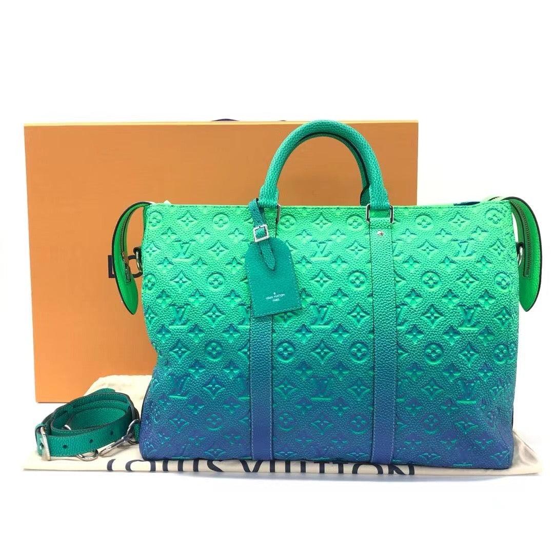 Louis Vuitton Virgil Abloh Green and Blue Monogram Illusion Leather Keepall Tote Silver Hardware, 2022
  These are professional photos of the actual bag offered by Luxbags.
  
  
  Louis Vuitton Virgil Abloh Green and Blue Monogram Illusion Leather
