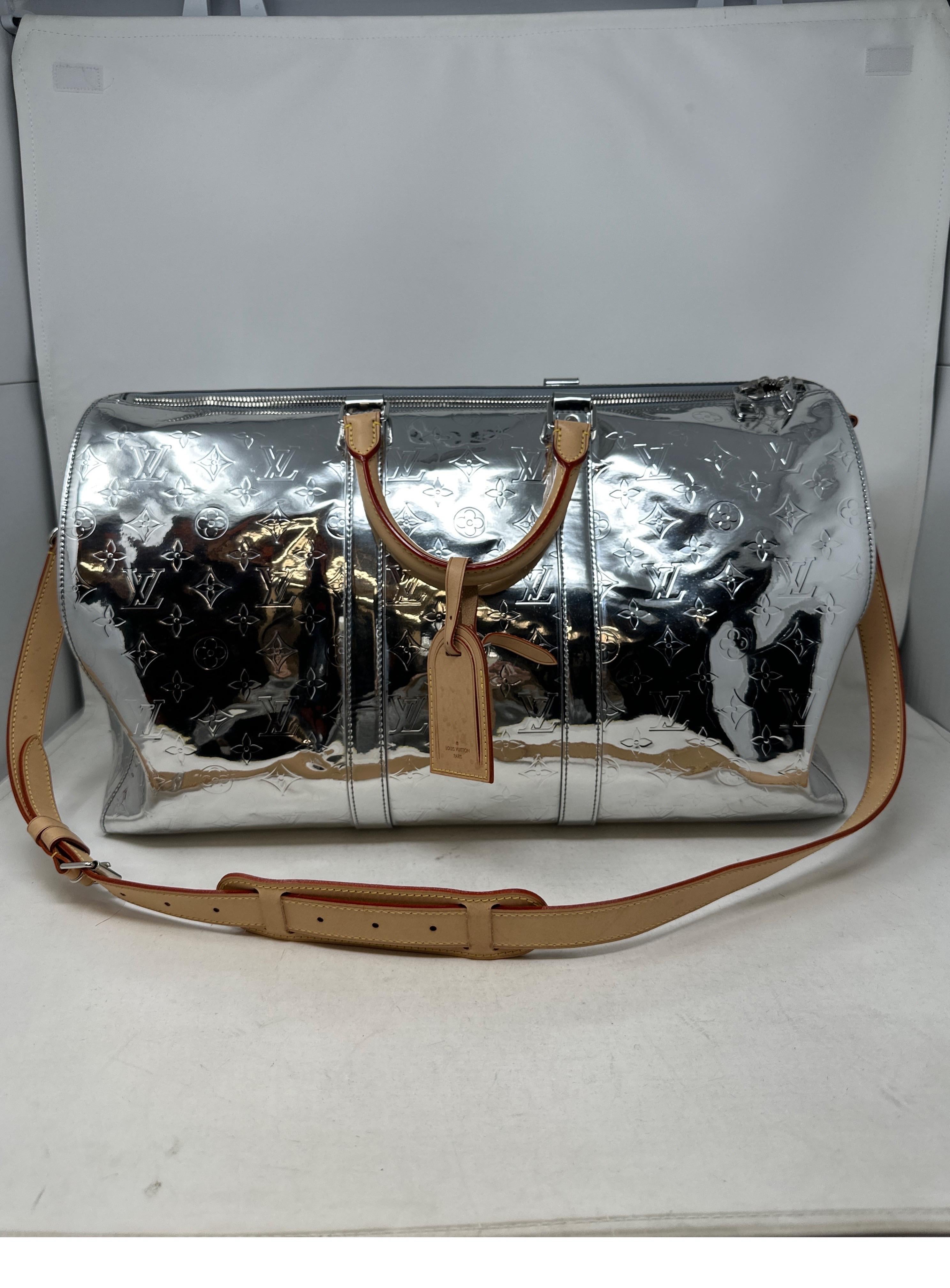 Louis Vuitton Virgil Abloh Mirror Keepall 50 Bandouliere. Iconic and rare silver vernis patent leather monogram. Silver mirror collection from 2021. Limited edition by Virgil. The most wanted luggage for collectors. Excellent like new condition.