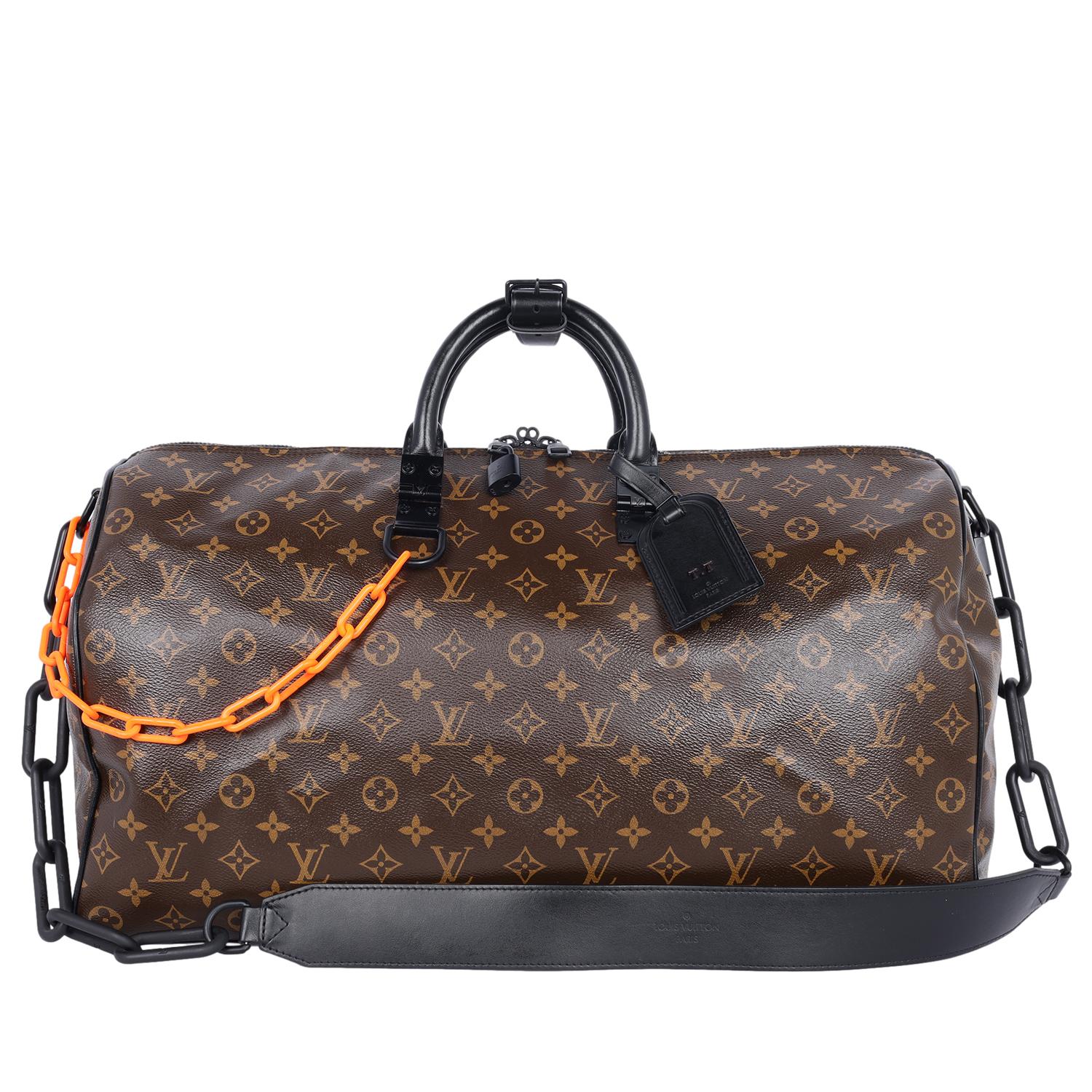 Authentic, pre-loved Louis Vuitton Virgil Abloh Monogram Chain Keepall Bandouliere 50.  The Louis Vuitton Keepall 50 features the classic monogram print in a coated calfskin canvas with matte black detailing and piping. Bright orange and black