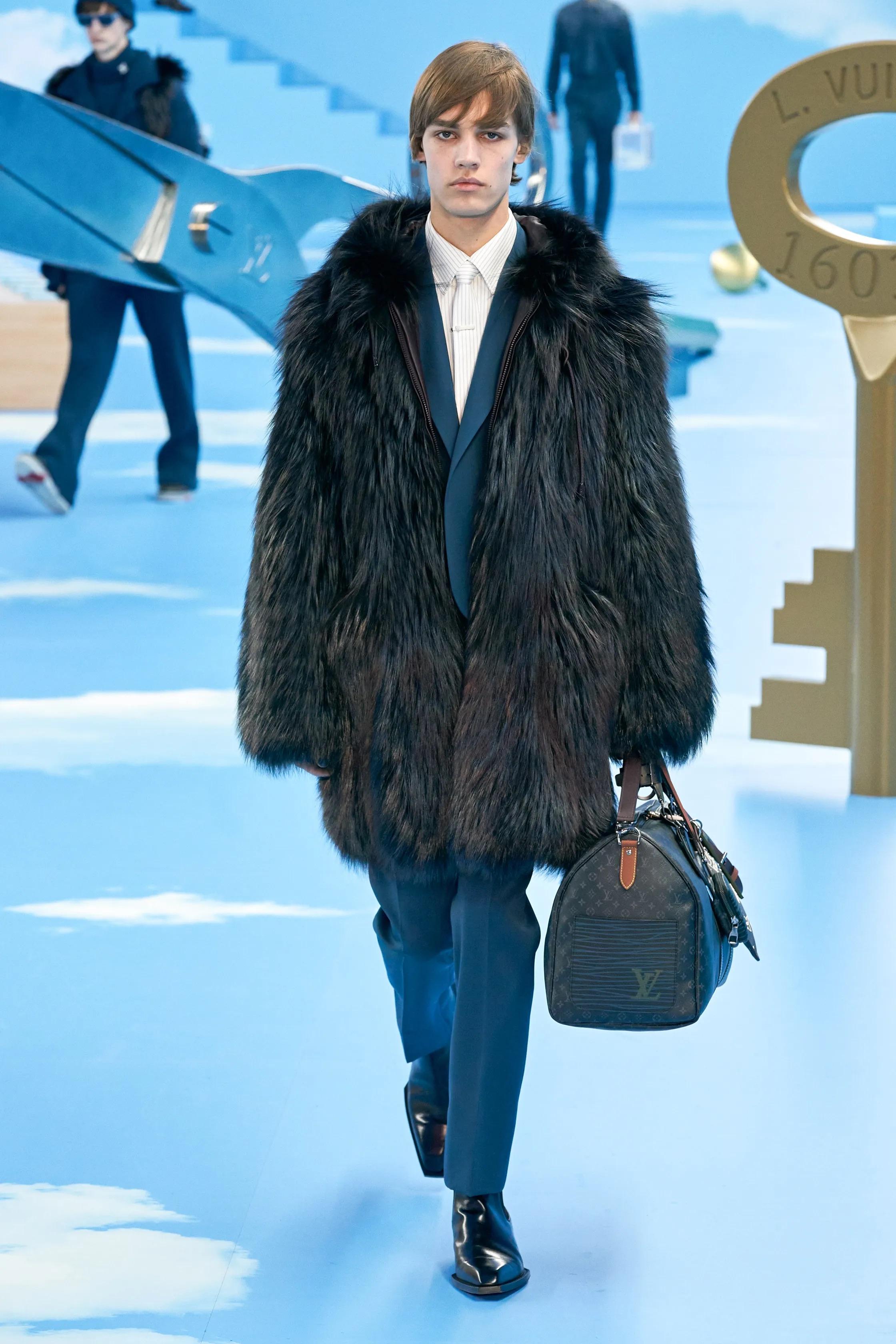 This beautiful Coat was Part of the FW19 Menswear Runway Show by Virgil Abloh 
The LV Logo on the back was hand-cut by Virgil himself using a classic razor which gives this piece an artistic touch and will make this a piece of Fashion history.
This
