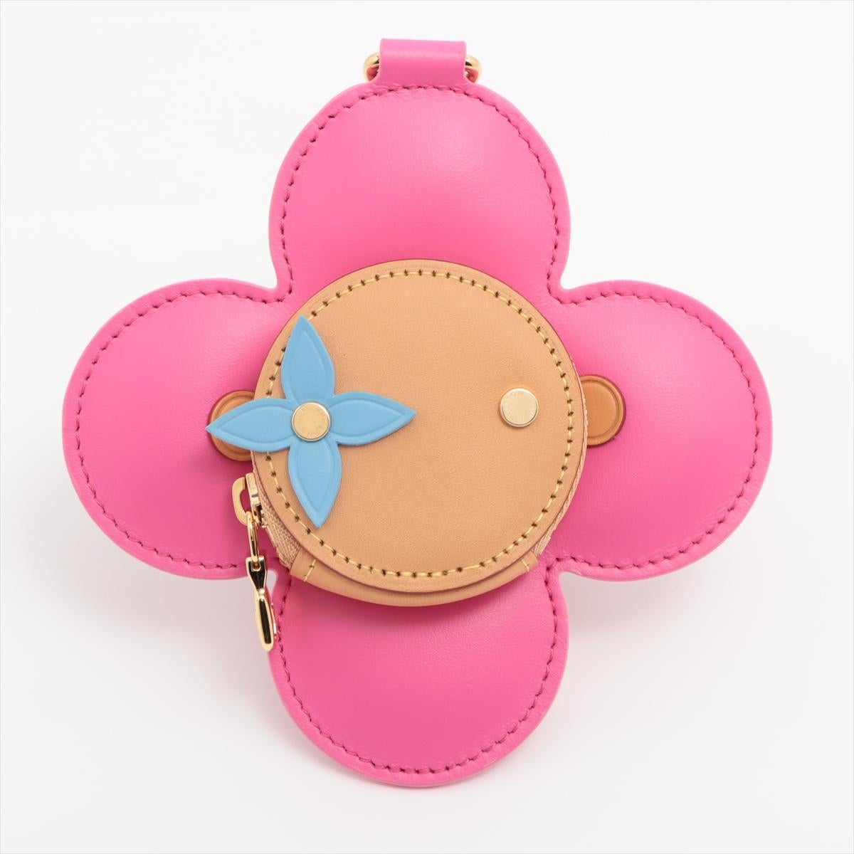 The Louis Vuitton Vivienne Coin Purse is a charming accessory that embodies the brand's luxury and elegance. Crafted with meticulous attention to detail, the coin purse features iconic Vivienne mascot character, adorned with the signature LV flower