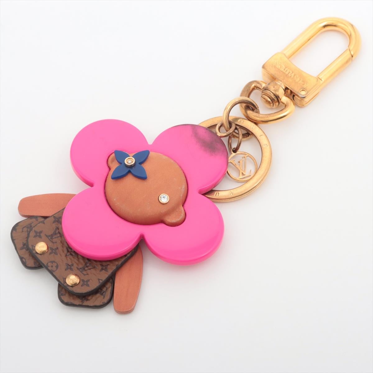 The Louis Vuitton Vivienne Puppet Bag Charm is a whimsical and charming accessory that brings a playful spirit to any Louis Vuitton bag. Meticulously crafted, the puppet charm features a miniature version of Vivienne, Louis Vuitton's iconic mascot,