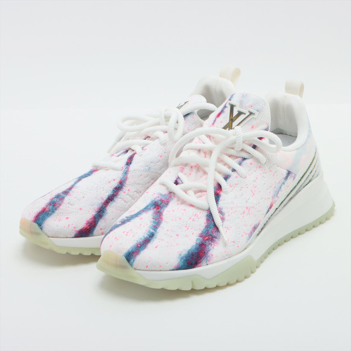 The Louis Vuitton V.N.R Sneakers in White and Pink offer a blend of sporty style and luxury craftsmanship. The sneakers feature a sleek white design accented with Blue and vibrant pink details, creating a striking contrast that catches the eye.