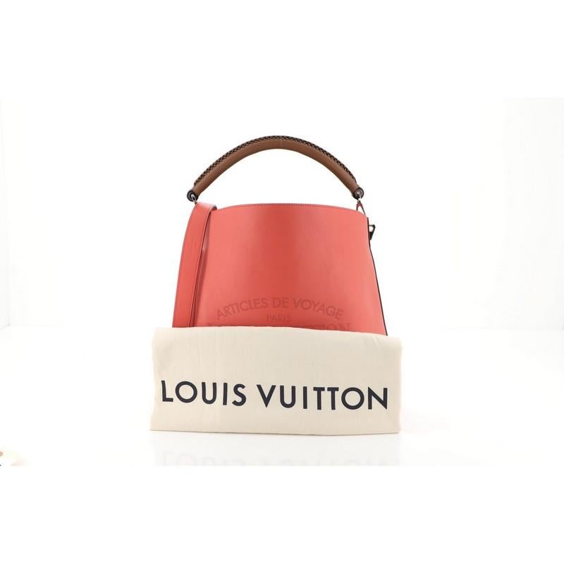 This Louis Vuitton Voyage Bagatelle Hobo Leather, crafted in red leather, features braided racine leather handle, signature Articles de Voyage logo, and silver-tone hardware. It opens to a spacious neutral suede interior with side zip and slip