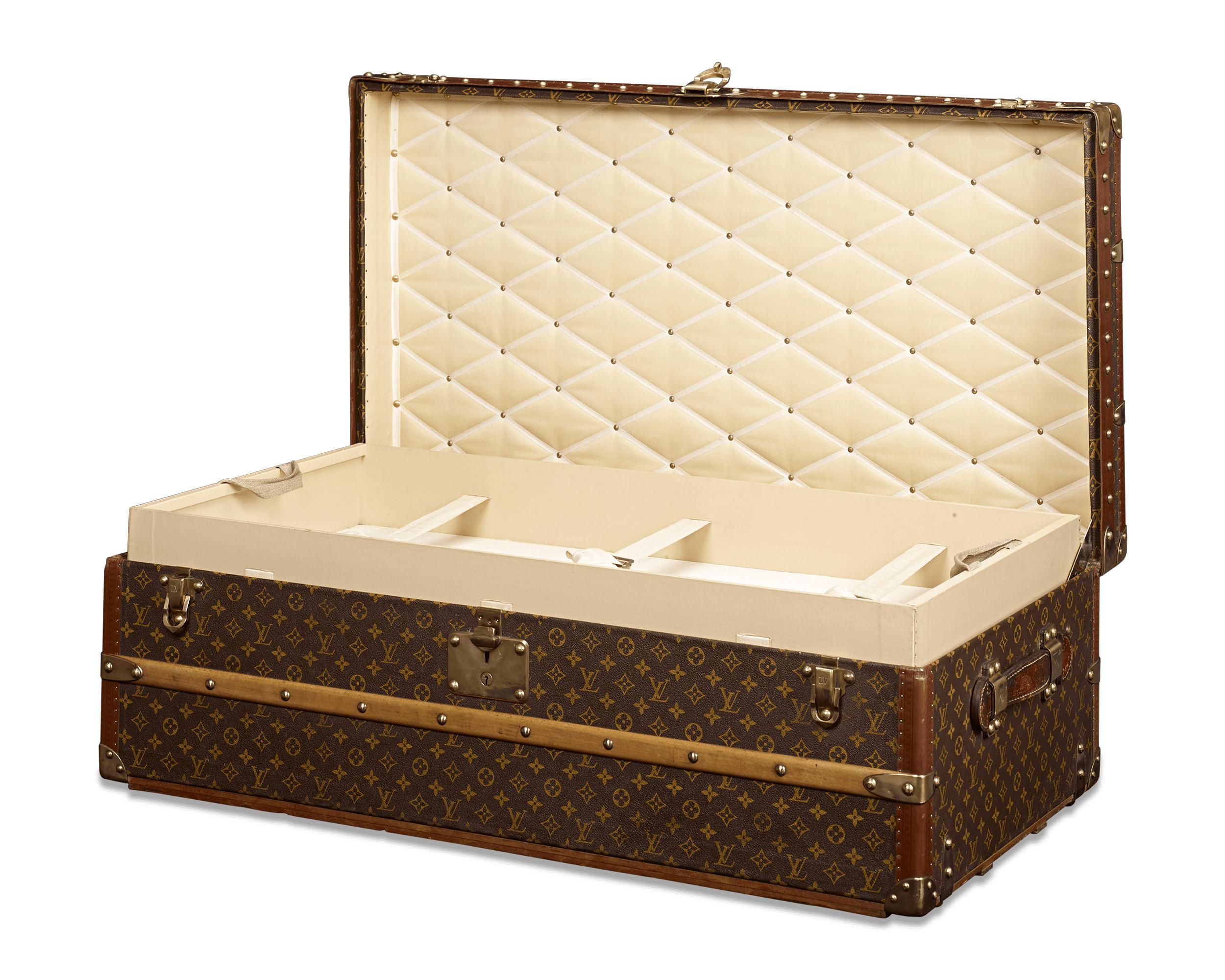 This rare and captivating antique Louis Vuitton wardrobe trunk embodies the elegance and sophistication of a bygone era. Boasting the iconic “LV” monogram on its leather-upholstered frame, this chest is designed for transporting wardrobe essentials