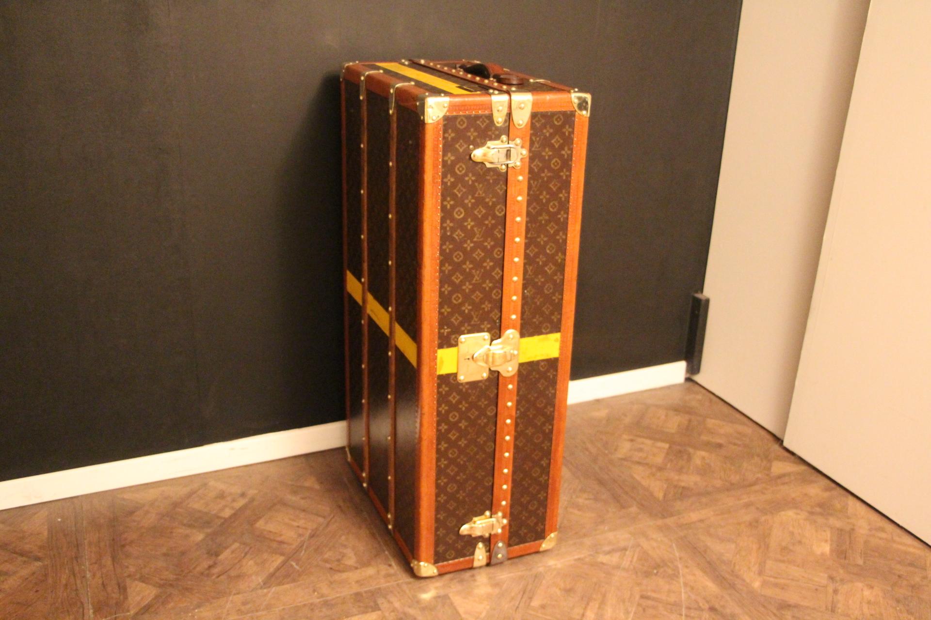This superb Louis Vuitton wardrobe features stenciled monogram canvas, lozine trims and solid brass lock, clasps and studs.
Lock,clasps and studs are all marked Louis Vuitton. Customised painted stub all around adds some personality and