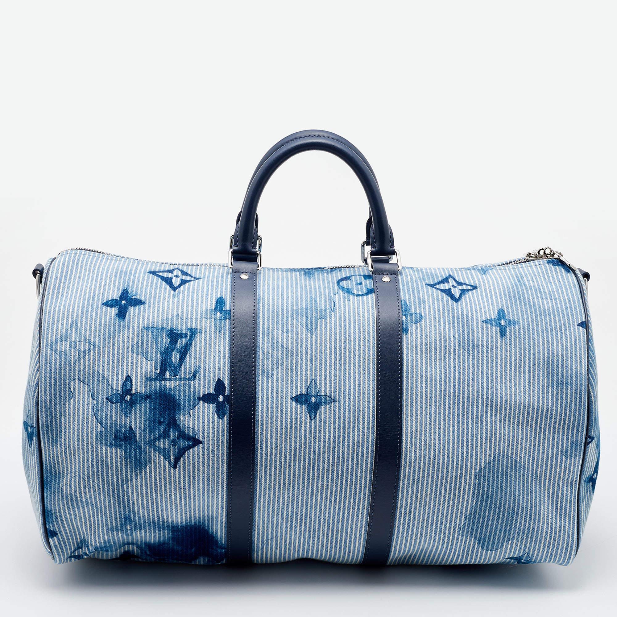 The iconic Keepall is given a new spin in watercolor denim with monograms all over. The Keepall Bandoulier 50 is added with leather trims, handles, shoulder straps, and a spacious interior to house your gym, travel, and daily necessities.

Includes: