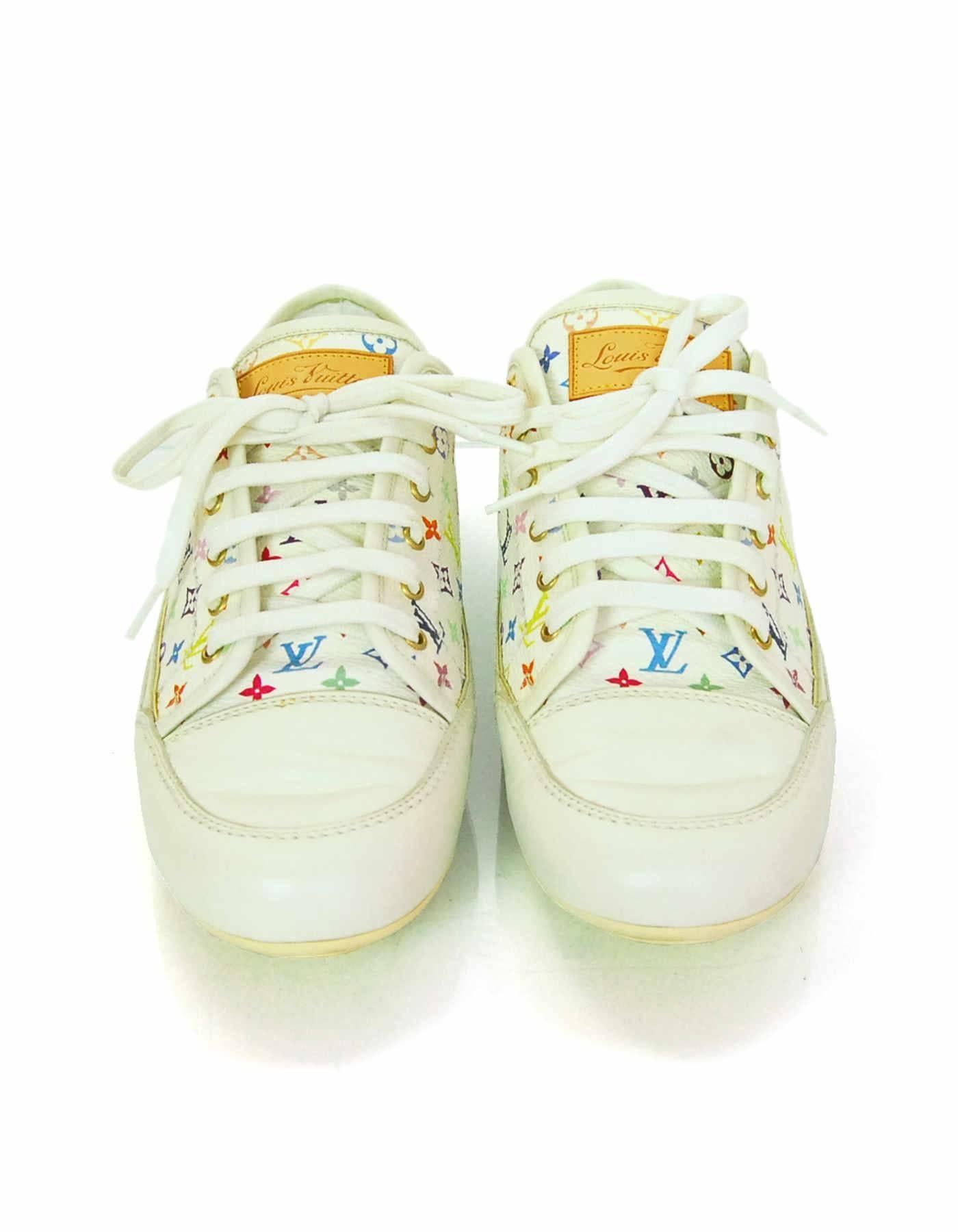Louis Vuitton White & Multi-Color Monogram Sneakers Sz 37.5

Made In: Italy
Color: White, multi
Closure/Opening: Lace tie closure
Sole Stamp: BA1007 37.5
Overall Condition: Very good pre-owned condition with the exception of some wear and soiling at