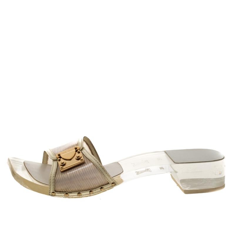 These chic sandals by Louis Vuitton are the most versatile pair you can possibly own. Wear these transparent acrylic shoes when you go out and watch heads turn. With leather trims and signature lock detail on the uppers, these are crafted to offer
