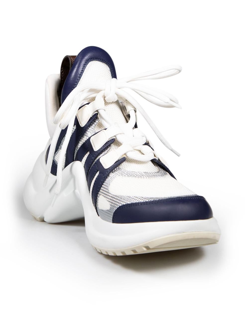 CONDITION is Very good. Minimal wear to shoes is evident. Minimal wear to the laces with discoloured marks on this used Louis Vuitton designer resale item.
 
 Details
 Model: Arclight
 White
 Cloth textile
 Trainers
 Navy leather trim
 Chunky sole

