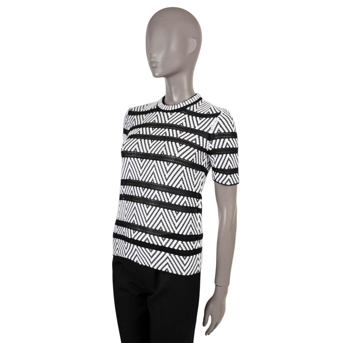 100% authentic Louis Vuitton pointelle striped chevron jacquard knit short sleeve sweater in back and white cotton (74%) and polyamide (26%). The design features sheer black pointelle panels and is unlined. Has been worn and is in excellent
