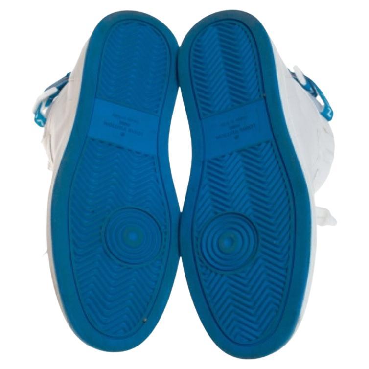 These Louis Vuitton high-top sneakers are trendy and stylish. Richly crafted in Italy from quality leather and detailed with signature-printed velcro straps and laces, they are sure to make a dream buy. These white-blue Rivoli sneakers also have