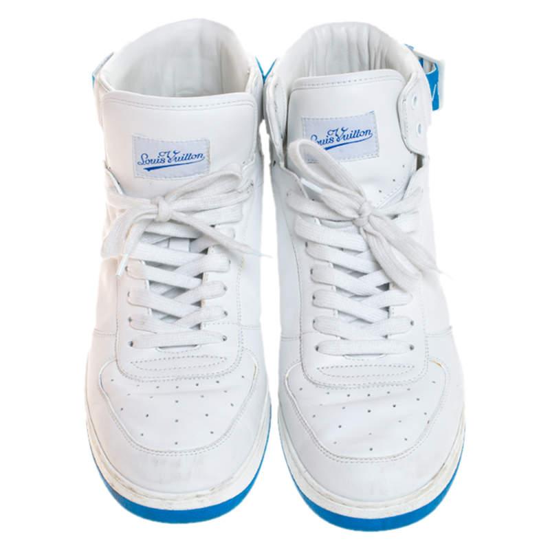 These Louis Vuitton high-top sneakers are trendy and stylish. Richly crafted in Italy from quality leather and detailed with signature-printed velcro straps and laces, they are sure to make a dream buy. These white-blue Rivoli sneakers also have