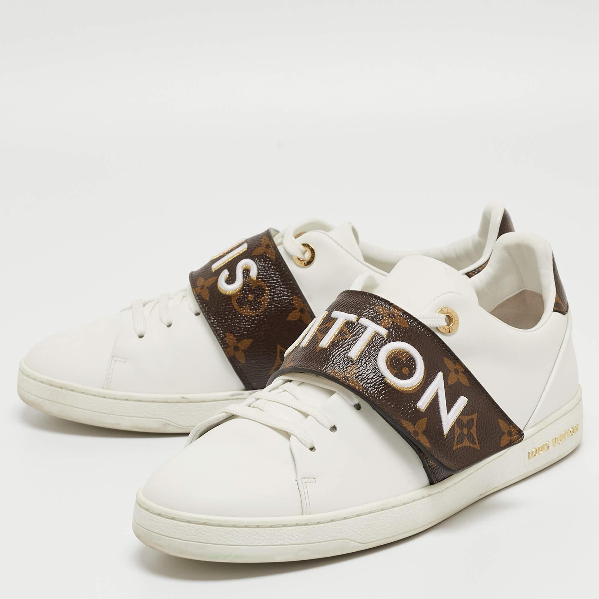 A great way to elevate your casual look, these white sneakers from Louis Vuitton feature a contrasting velcro strap over the lace-up vamps. The brand name vamps adds a luxe touch to the design.

