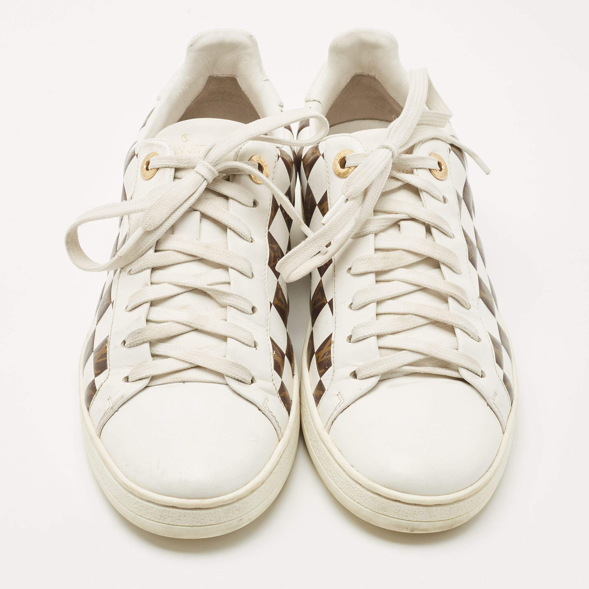 These Louis Vuitton sneakers are the ultimate step-up to bring style and attitude to your look. They are crafted from leather and coated canvas and have a lovely brown and white color combination. They have lace-ups as well as velcro closures and